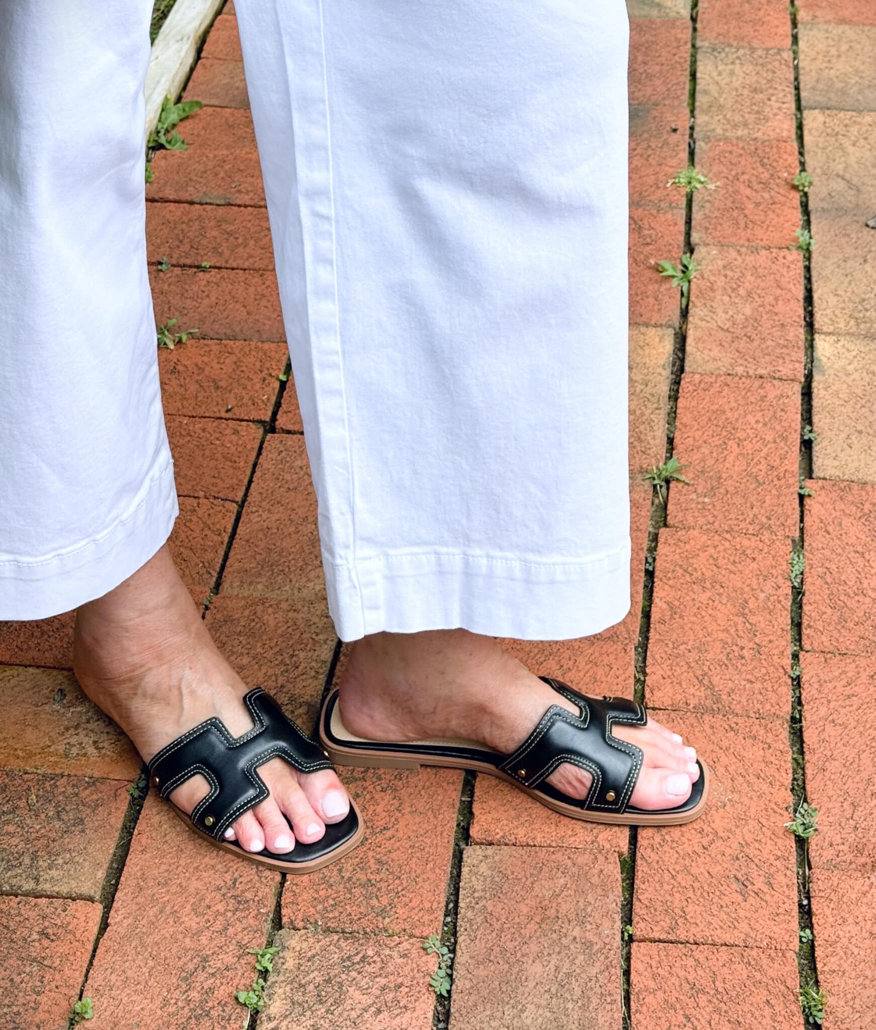 woman wearing black sandals