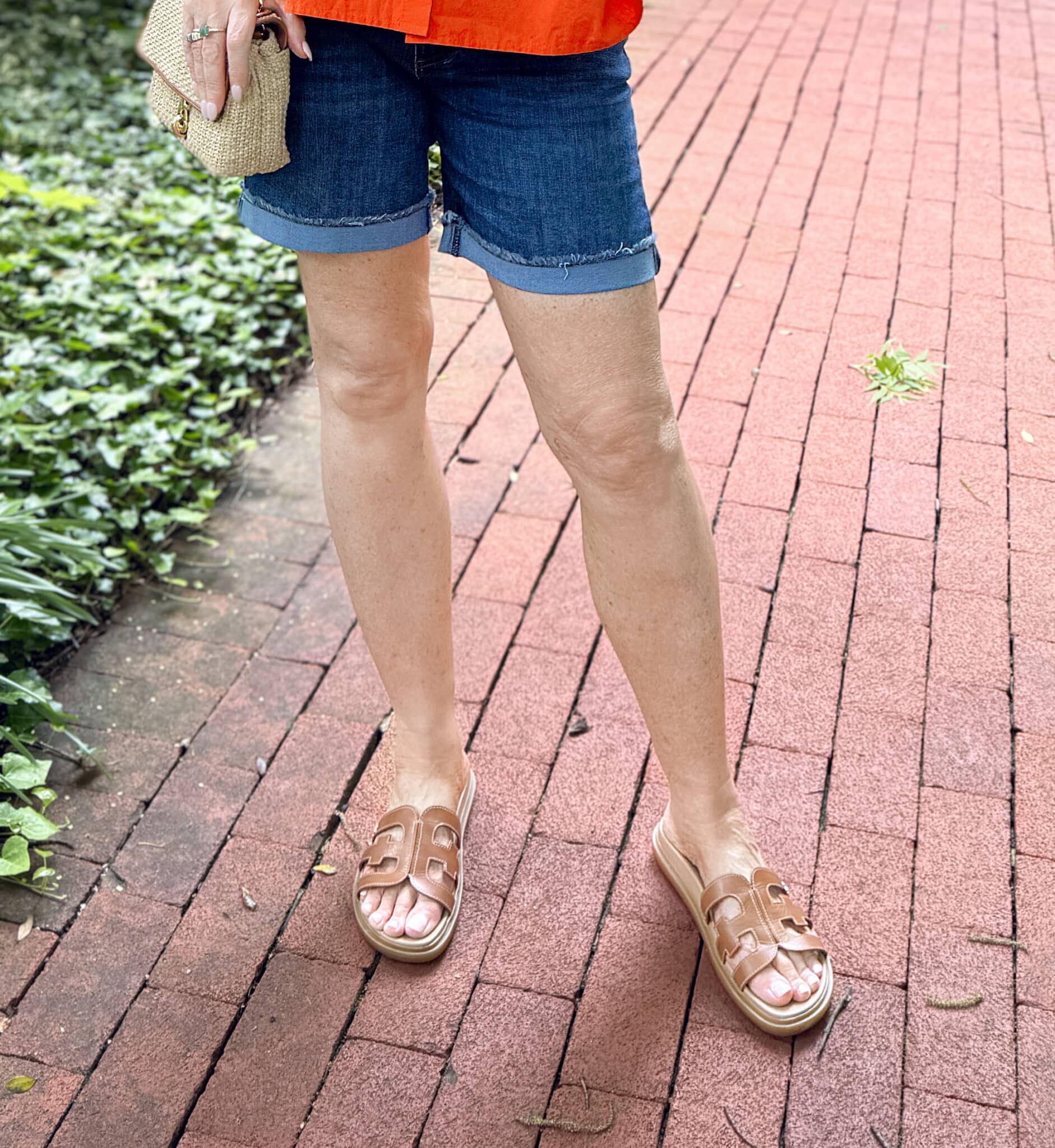 woman wearing cuffed denim shorts