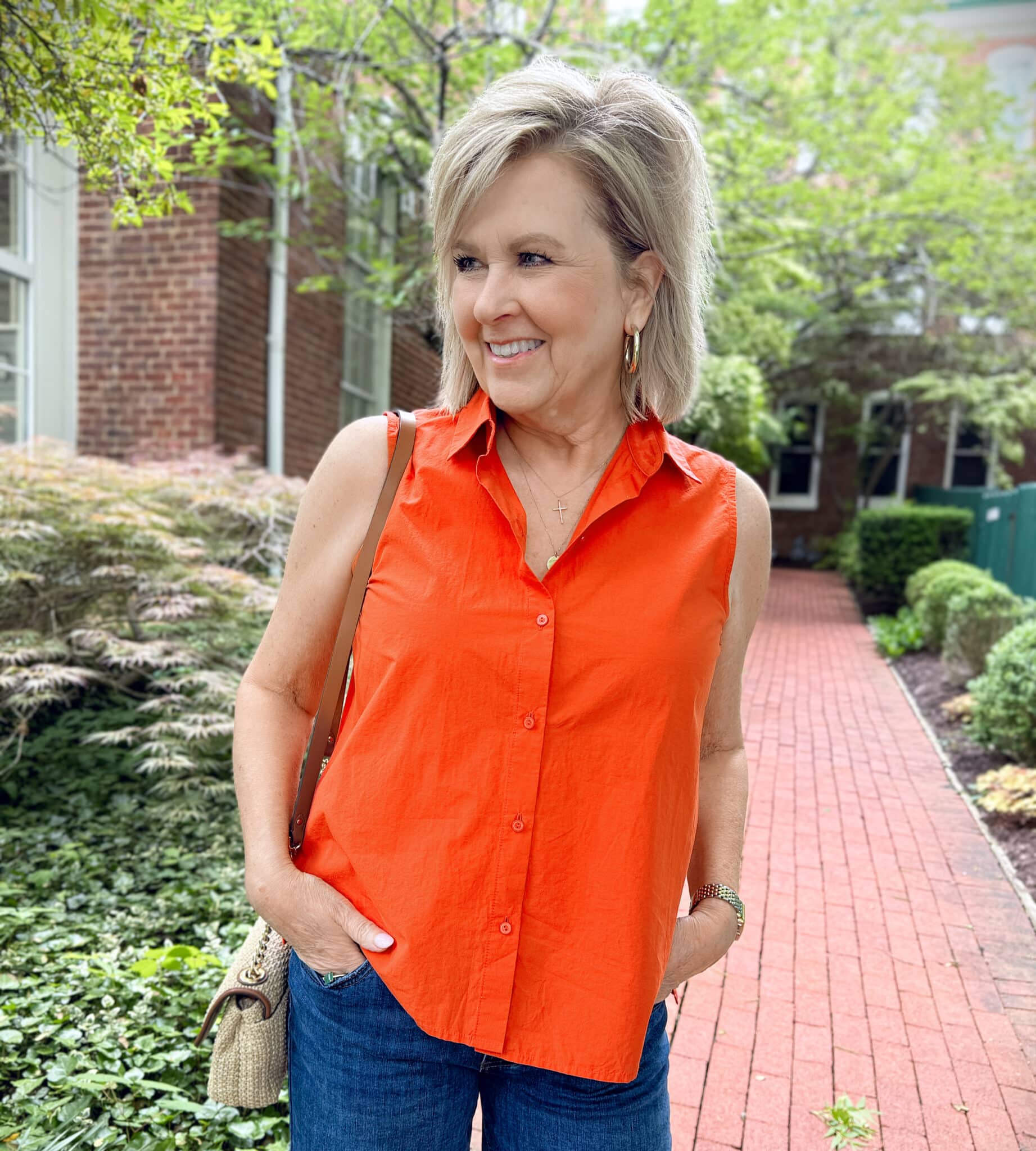 woman wearing a sleeveless orange top