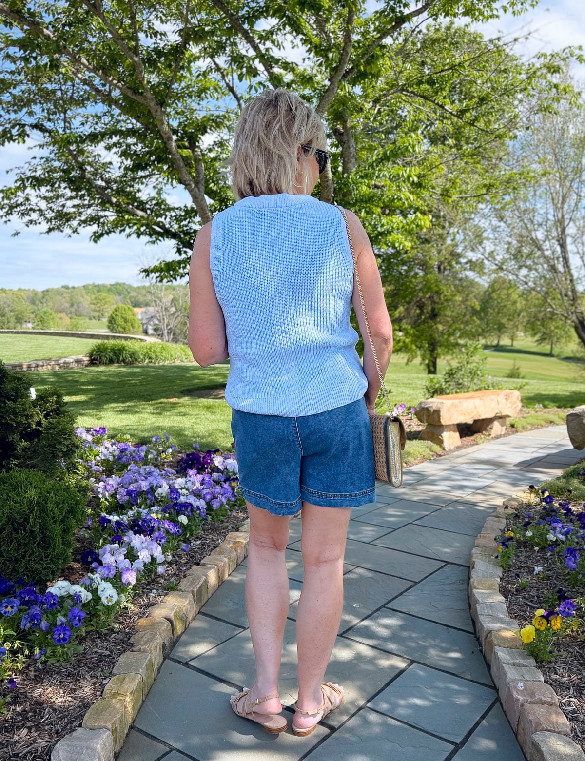 Tania Stephens wearing a blue sweater vest and the back of a denim skort from Talbots