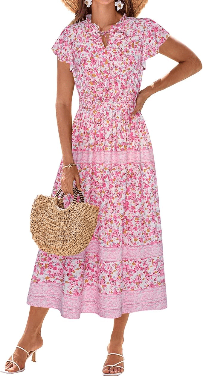a woman wearing a pink floral dress