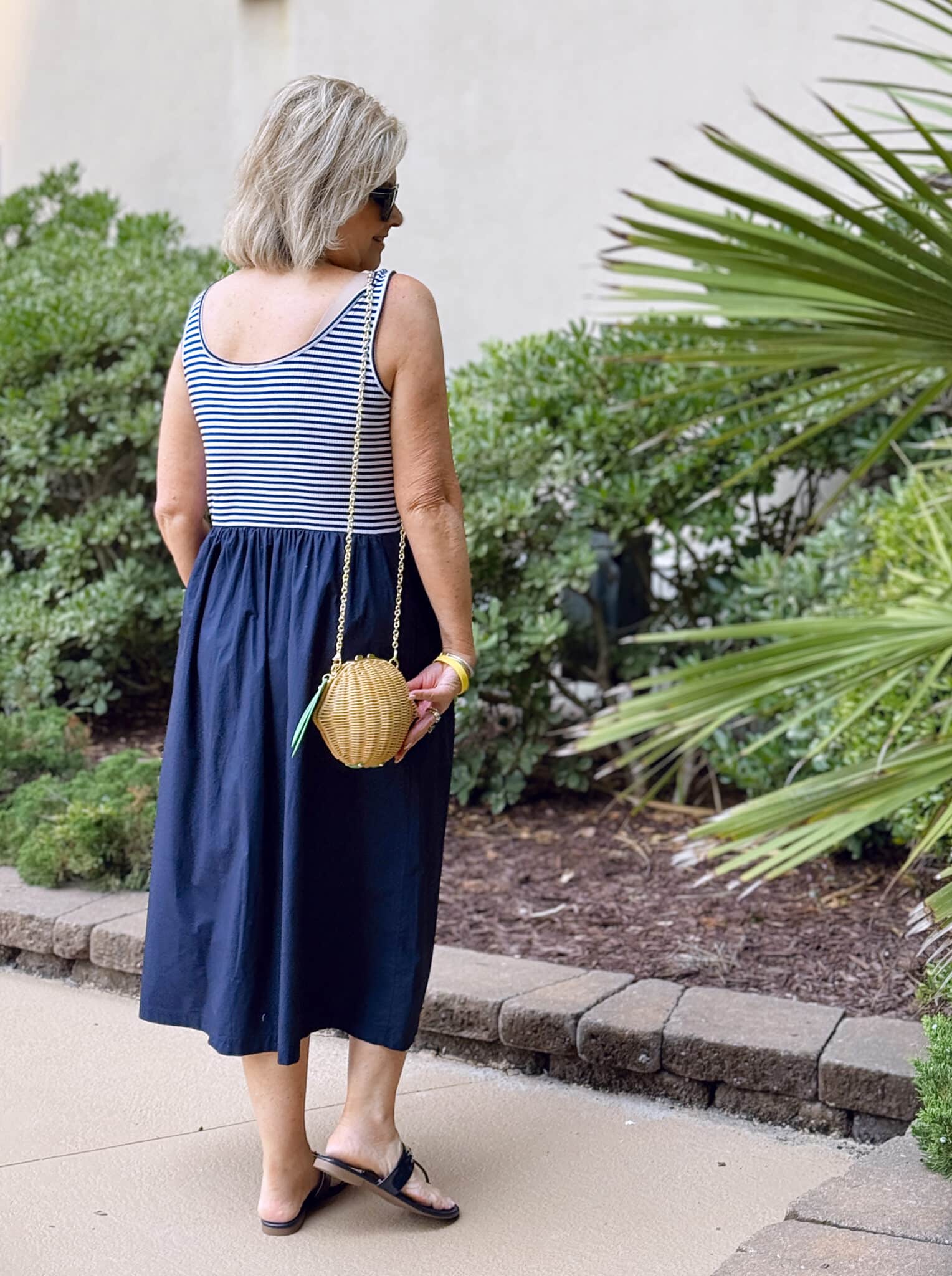 Tania Stephens at the beach showing the back of a navy & white striped midi dress from Talbots