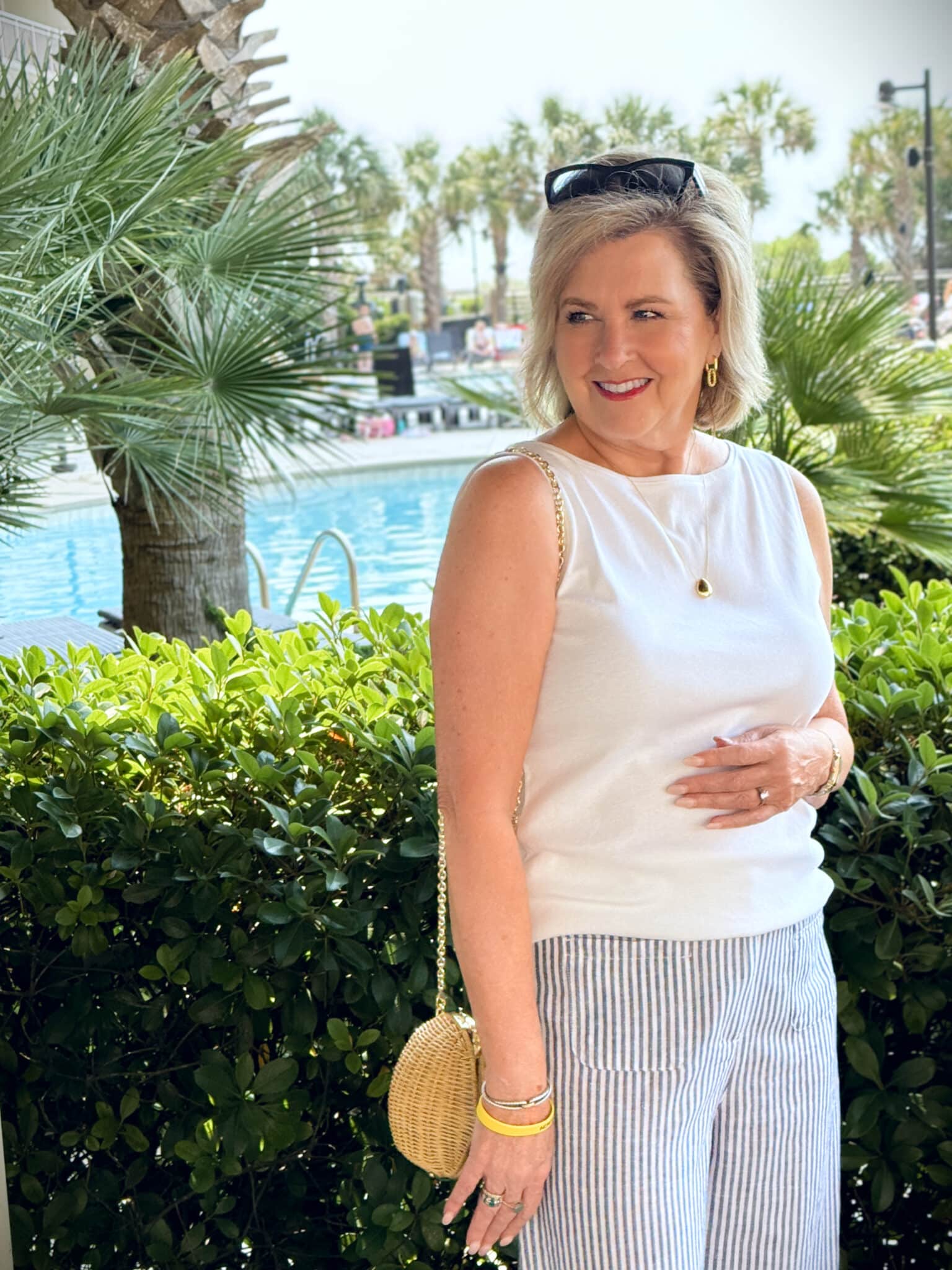 Tania Stephens at the beach wearing a white tank top from Talbots