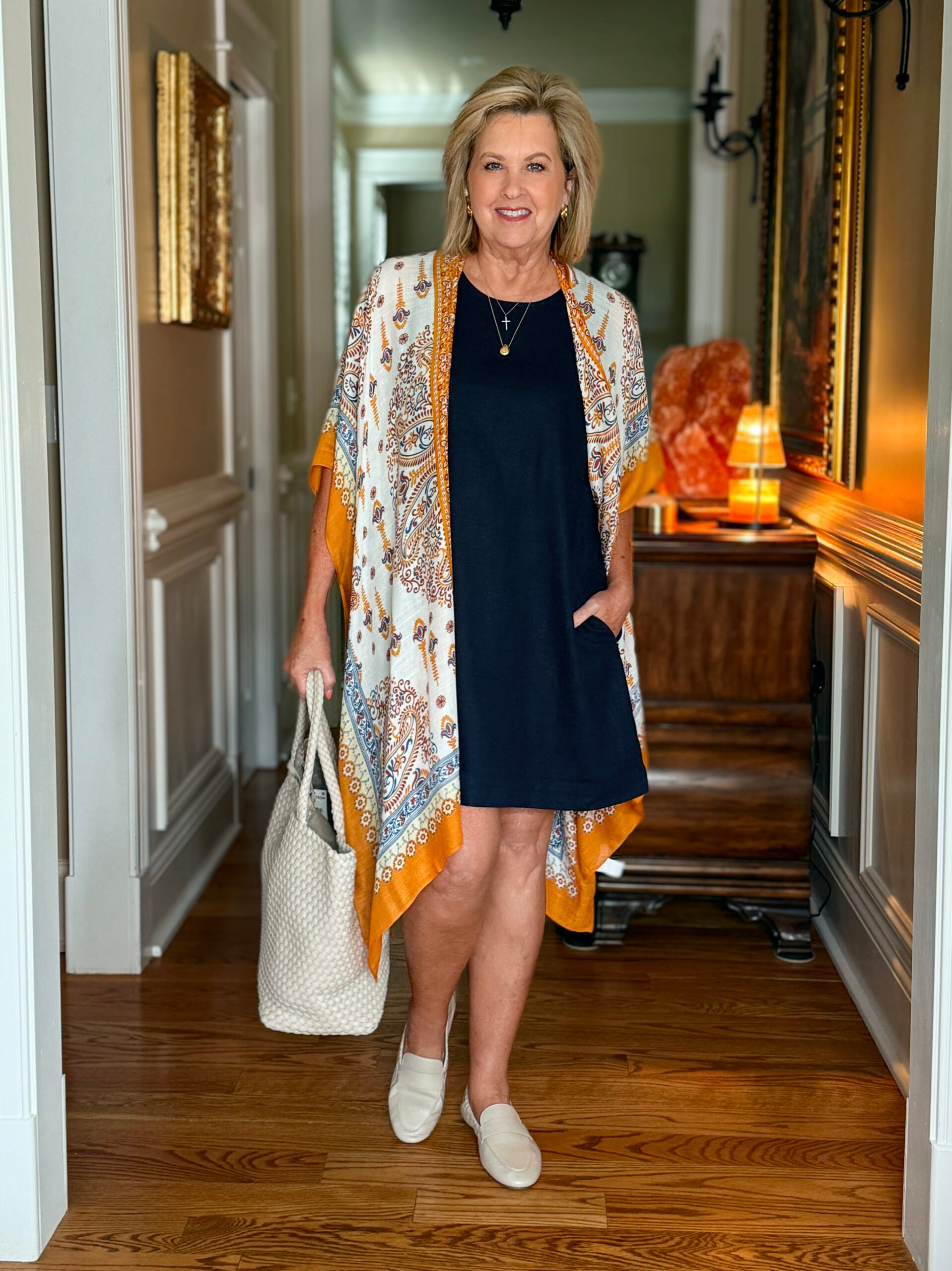 Tania wearing a kimono over her dress, styled with soft loafers and a neutral tote bag for a relaxed boho look.