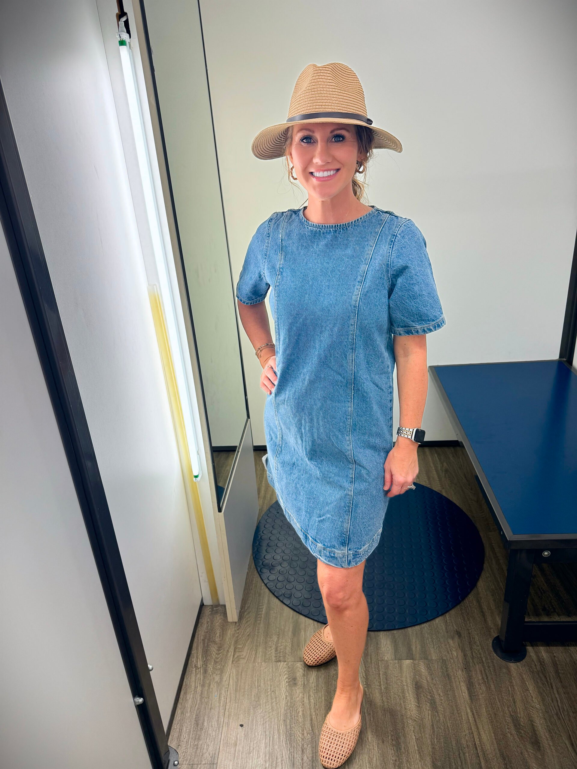 Stephanie wearing a denim dress with a straw hats and flats for petites from Old Navy