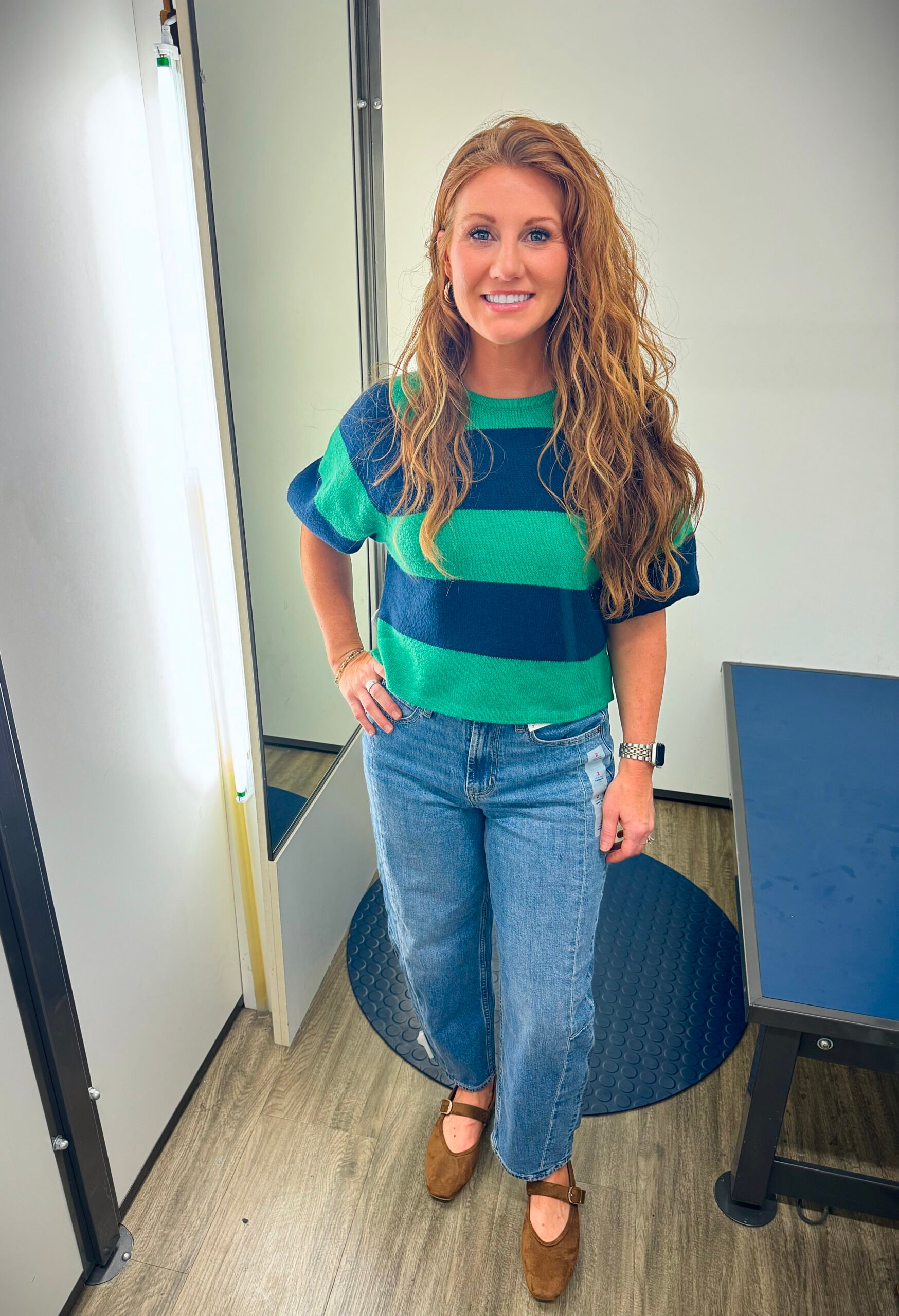 Stephanie wearing a striped puff sweater and barrel jeans from Old Navy