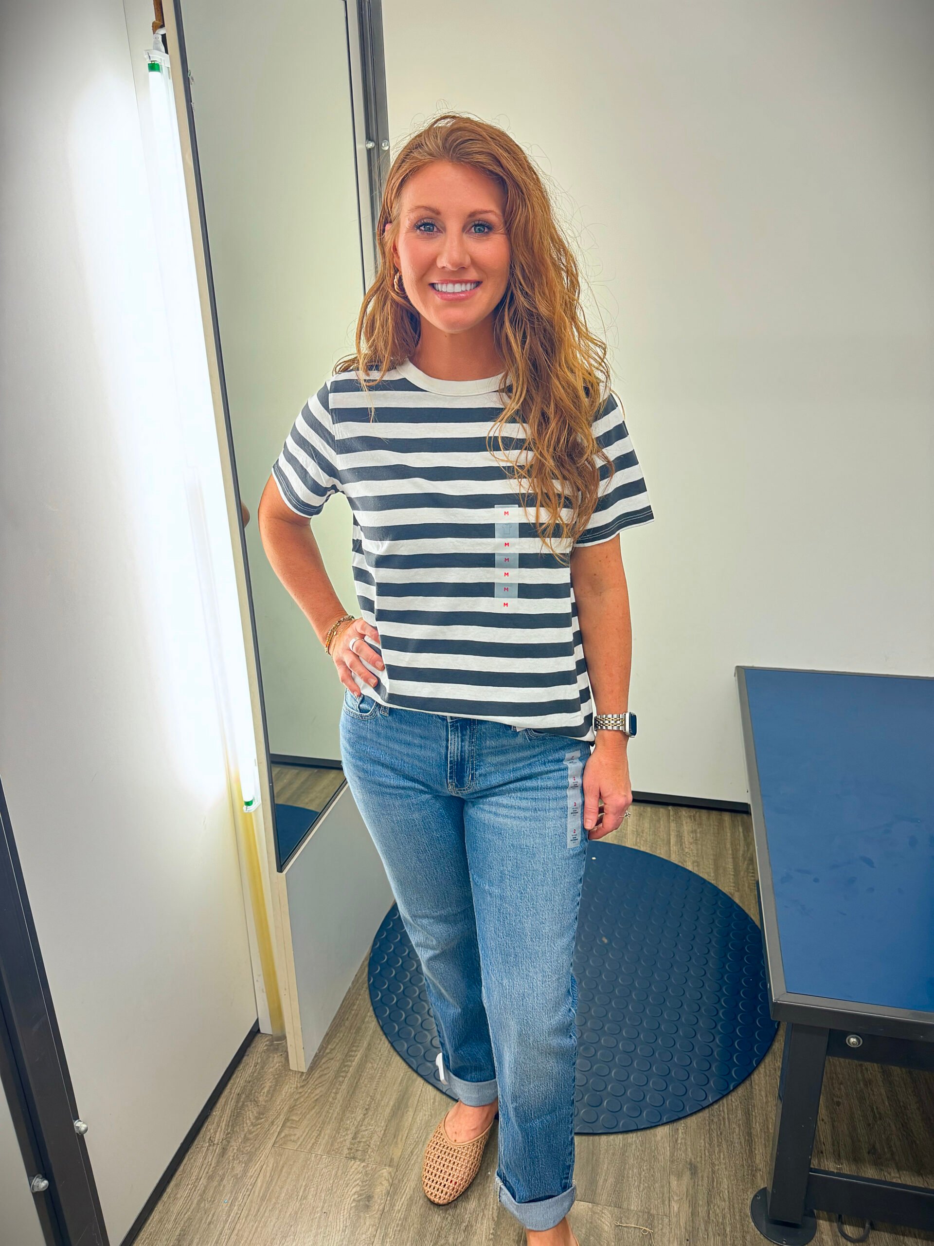 Stephanie wearing a striped tee and cuffed jeans from Old Navy