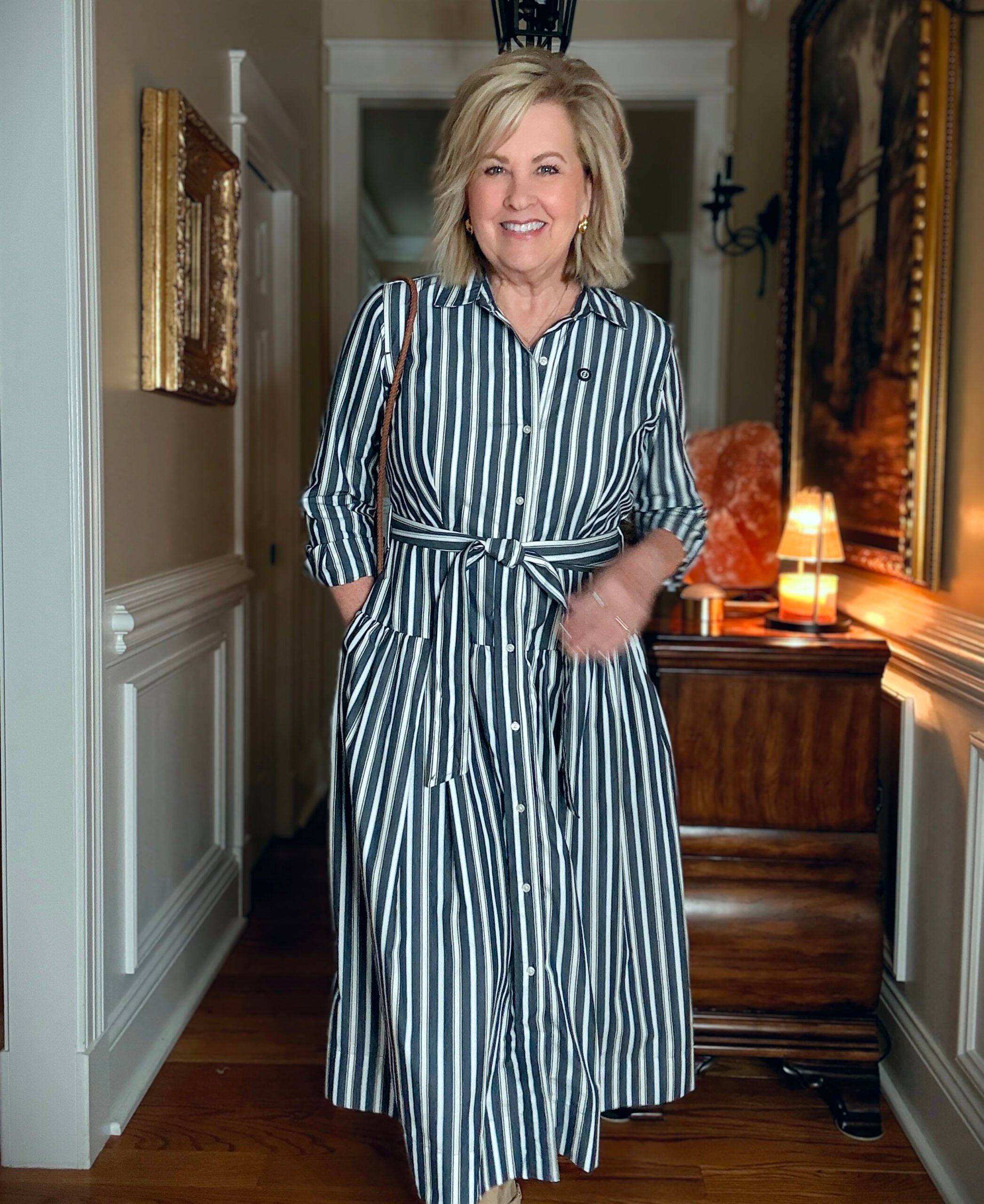 Tania is wearing a striped dress from Walmart