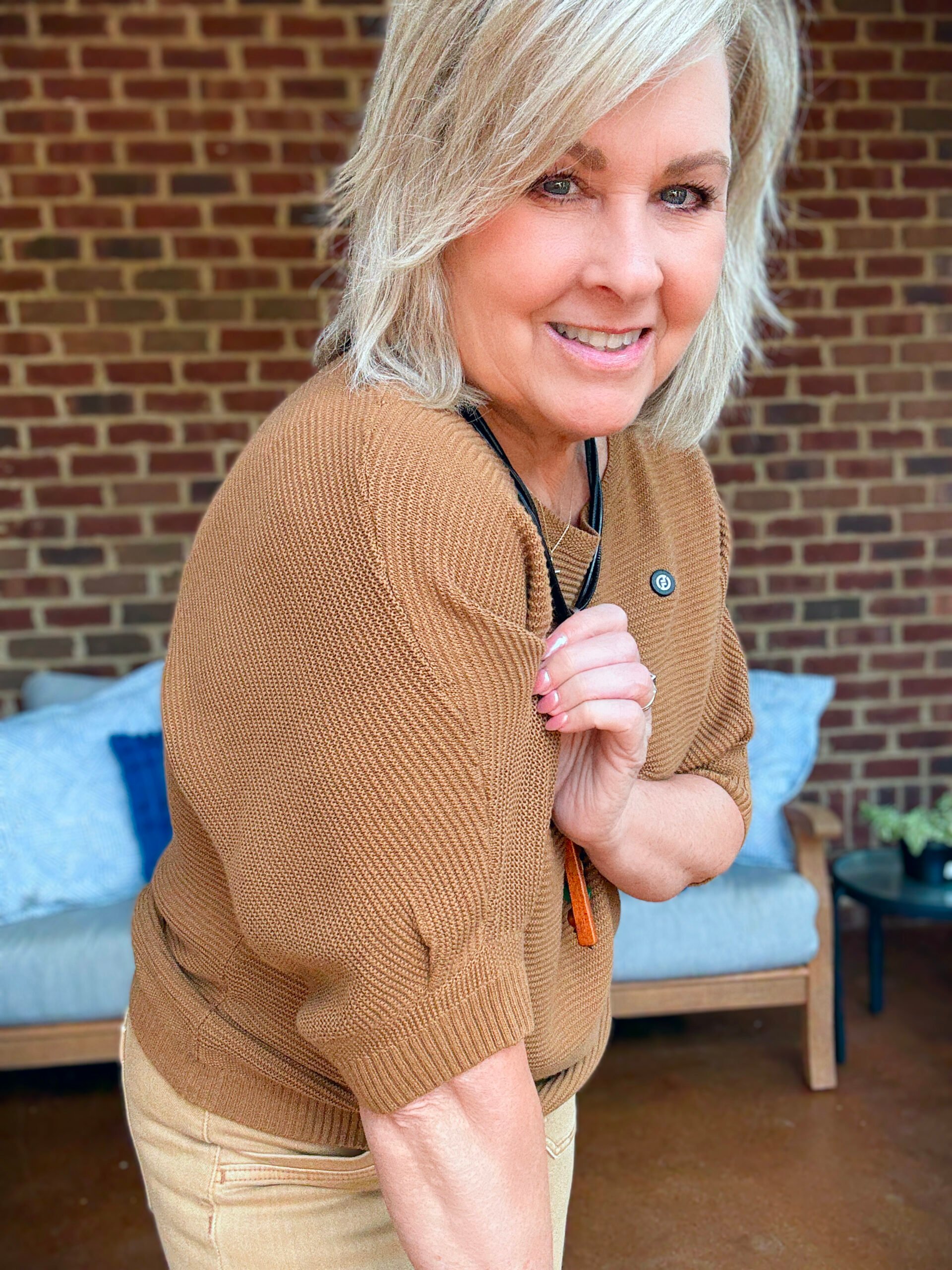 Tania Stephens showing a brown sweater's sleeve from Chico's