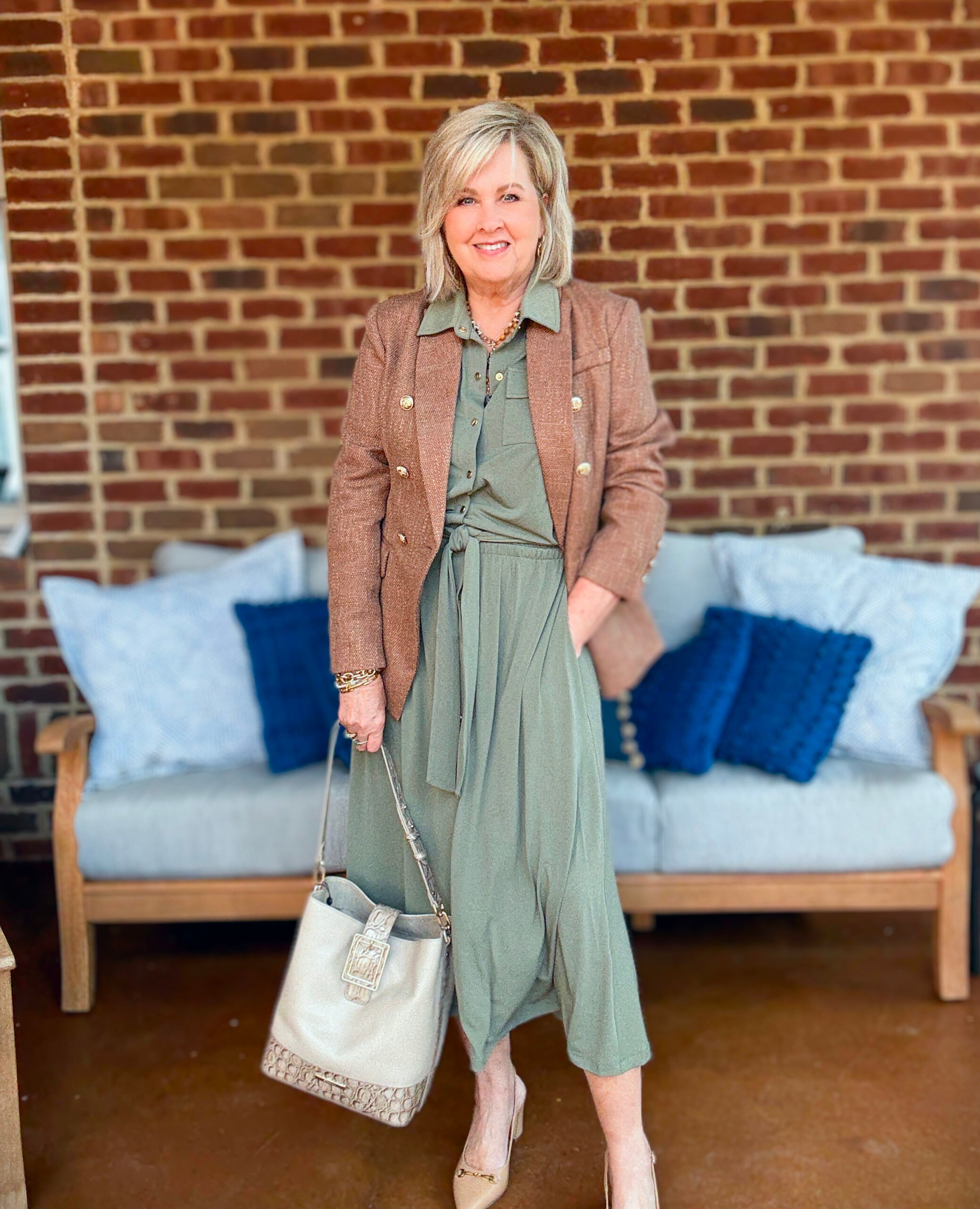 Tania Stephens wearing fall styles from Chico's - a tweed jacket with an olive knit dress and a Brahmin handbag