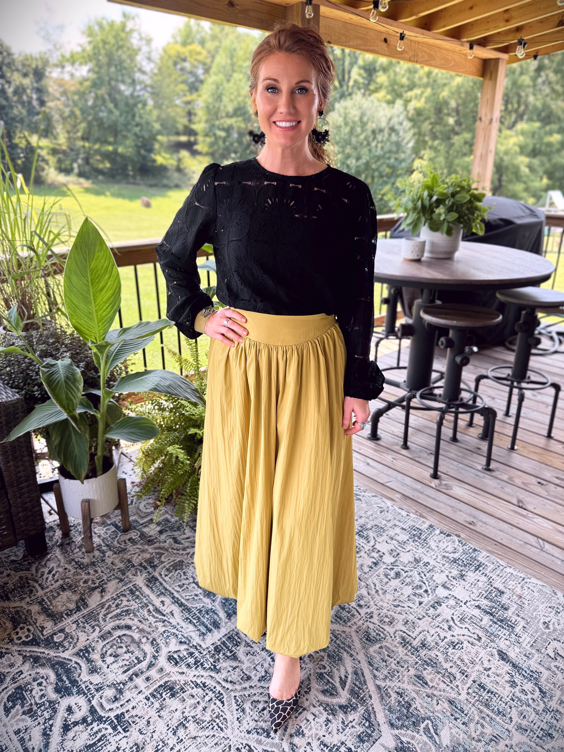 Stephanie wearing a chartreuse bubble skirt from Amazon with a black lace shirt