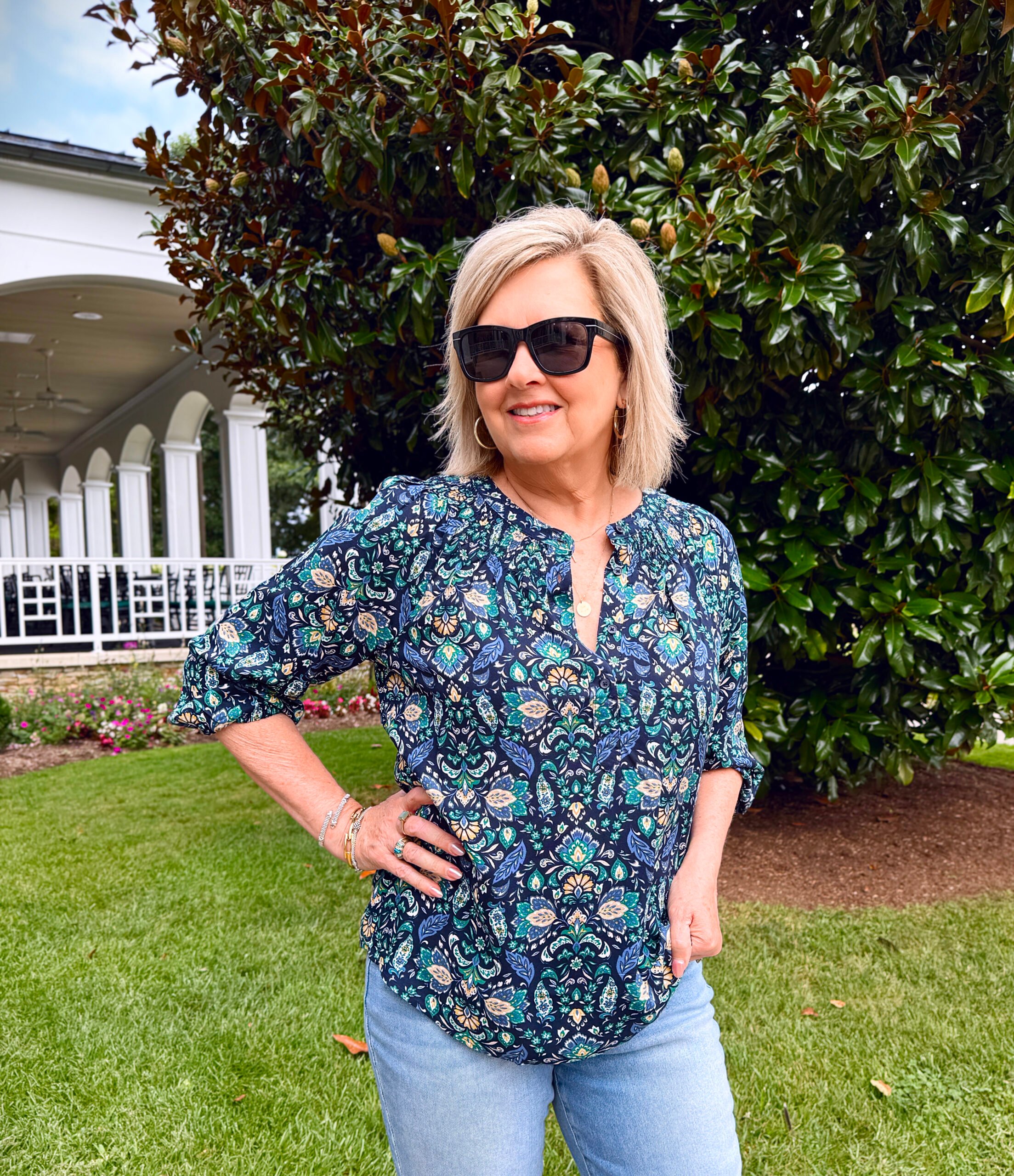 Tania Stephens wearing a blue pullover top 