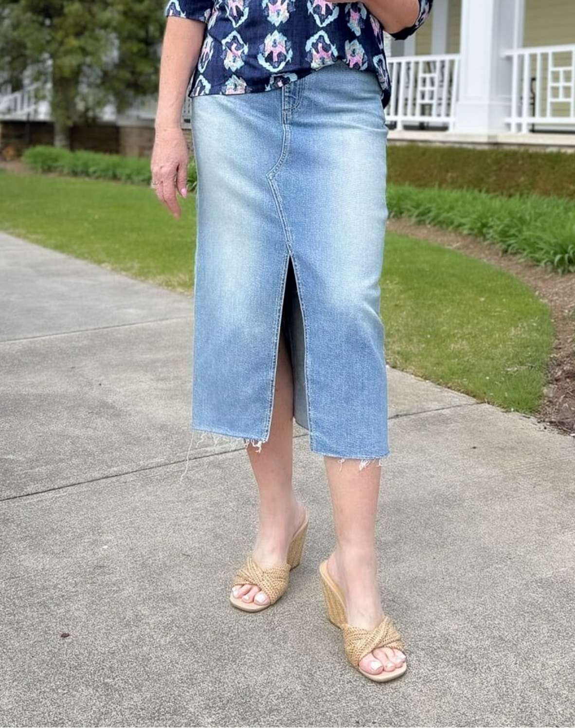 a woman wearing a skirt and sandals