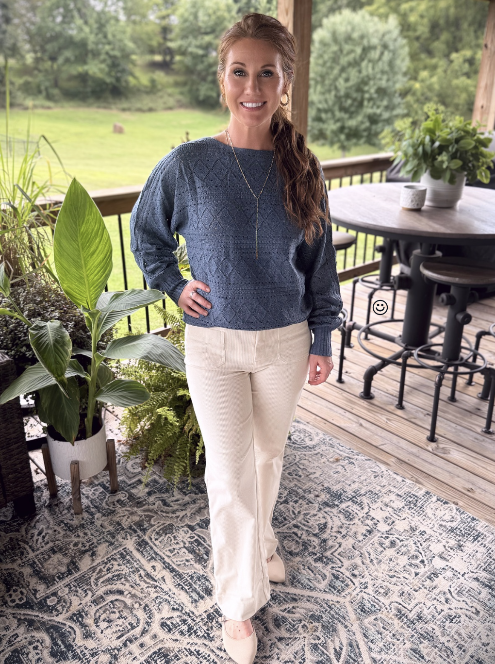 Stephanie wearing a blue shirt from Amazon with light corduroy pants