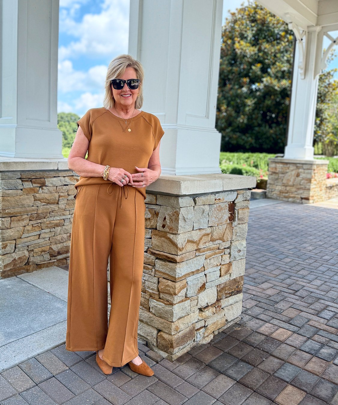 Tania wearing an air-knit sort sleeve top and pleated pants from Talbots