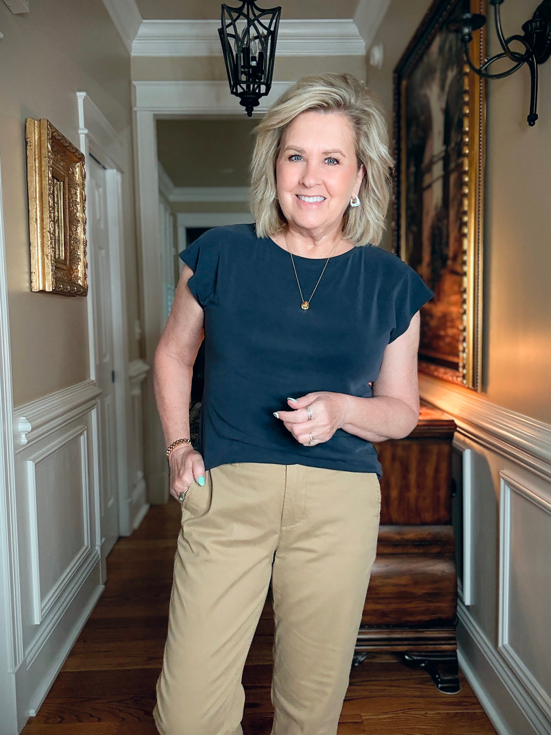 Tania Stephens in a hallway wearing a navy tee from J.Crew Factory
