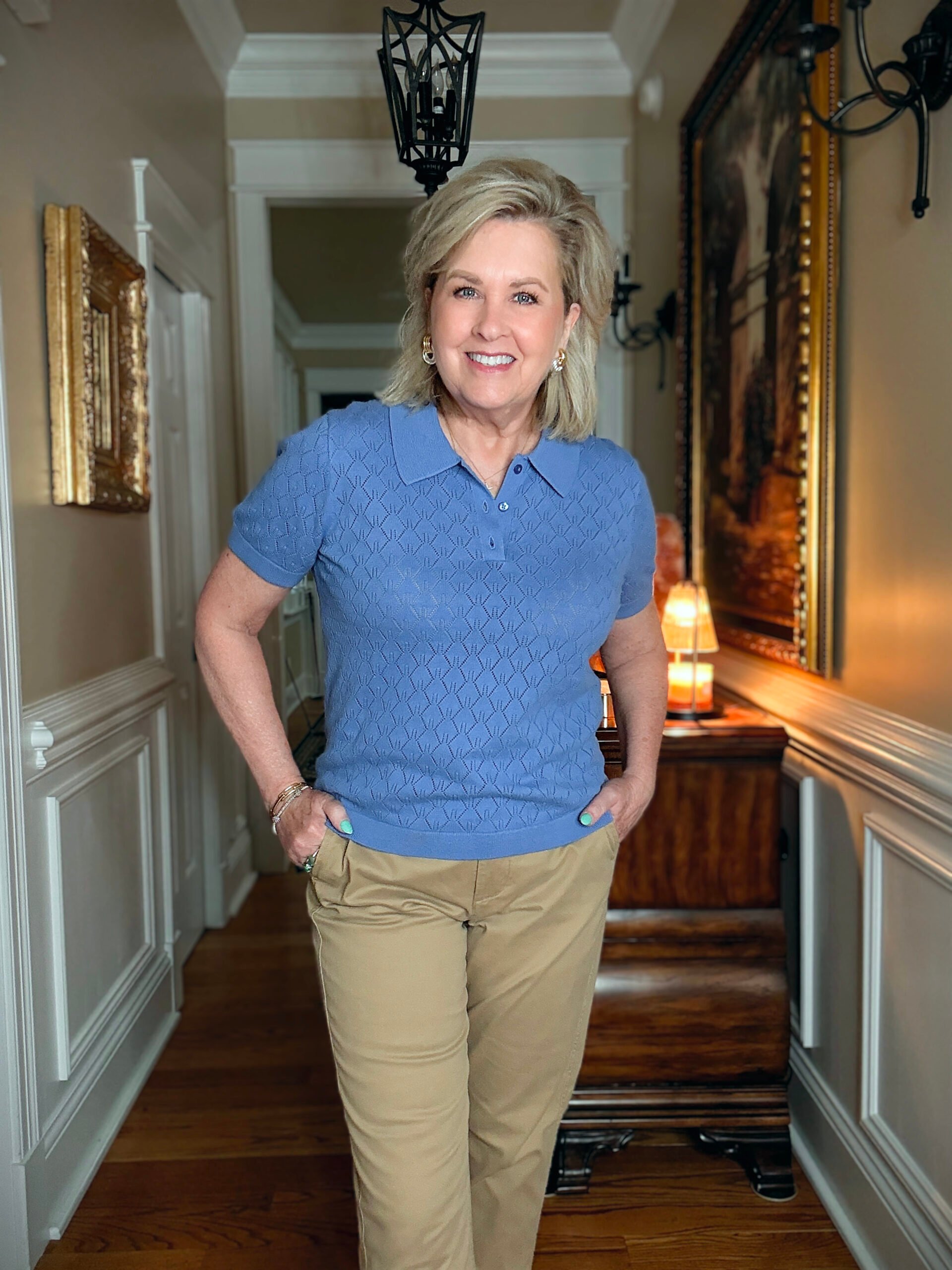 Tania Stephens in a hallway wearing a pointelle collared sweater from J.Crew Factory