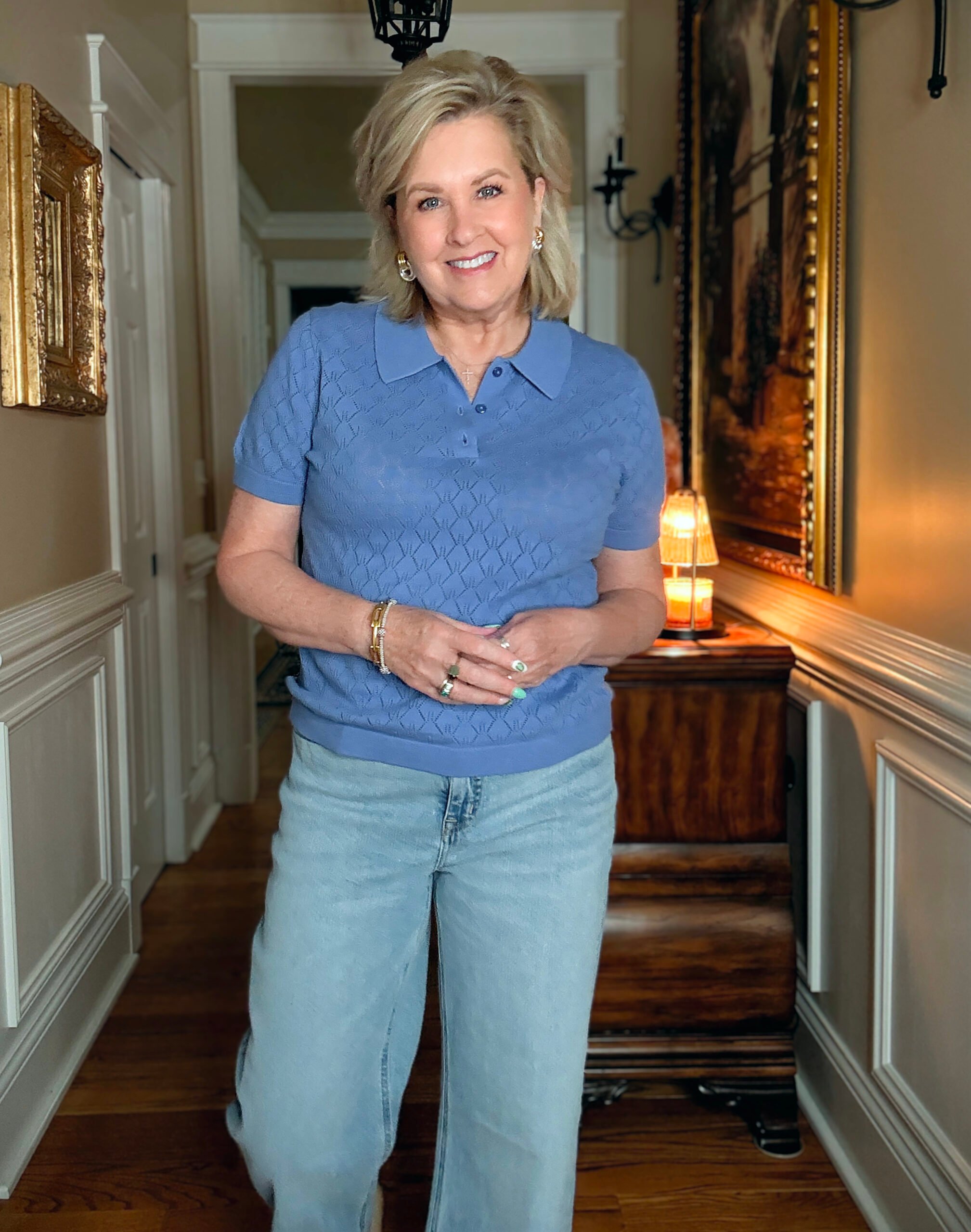 Tania Stephens in a hallway wearing a pointelle collared sweater from J.Crew Factory