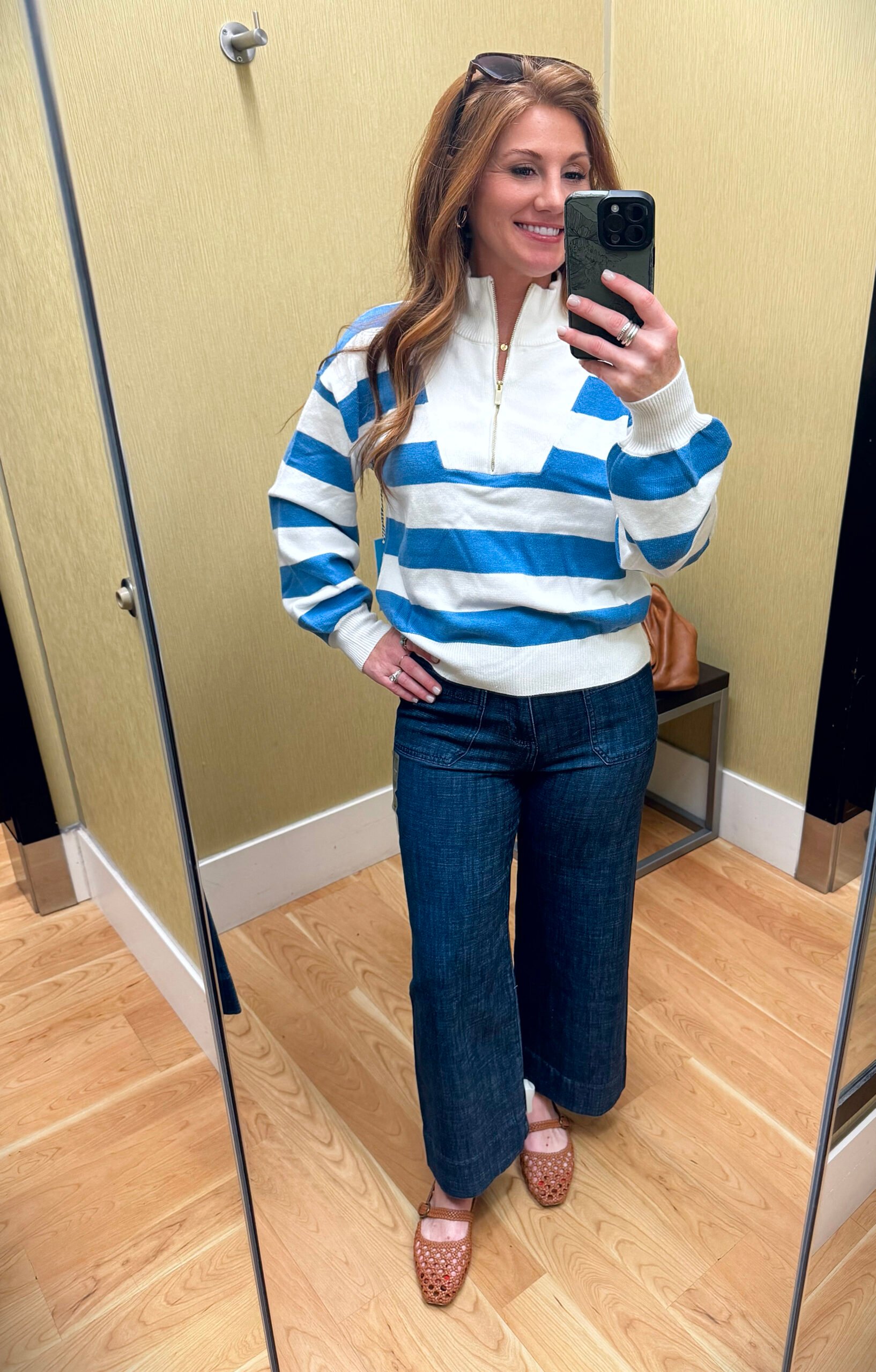 Stephanie trying on a bubble sleeve top from Kohl’s with gold detail accents