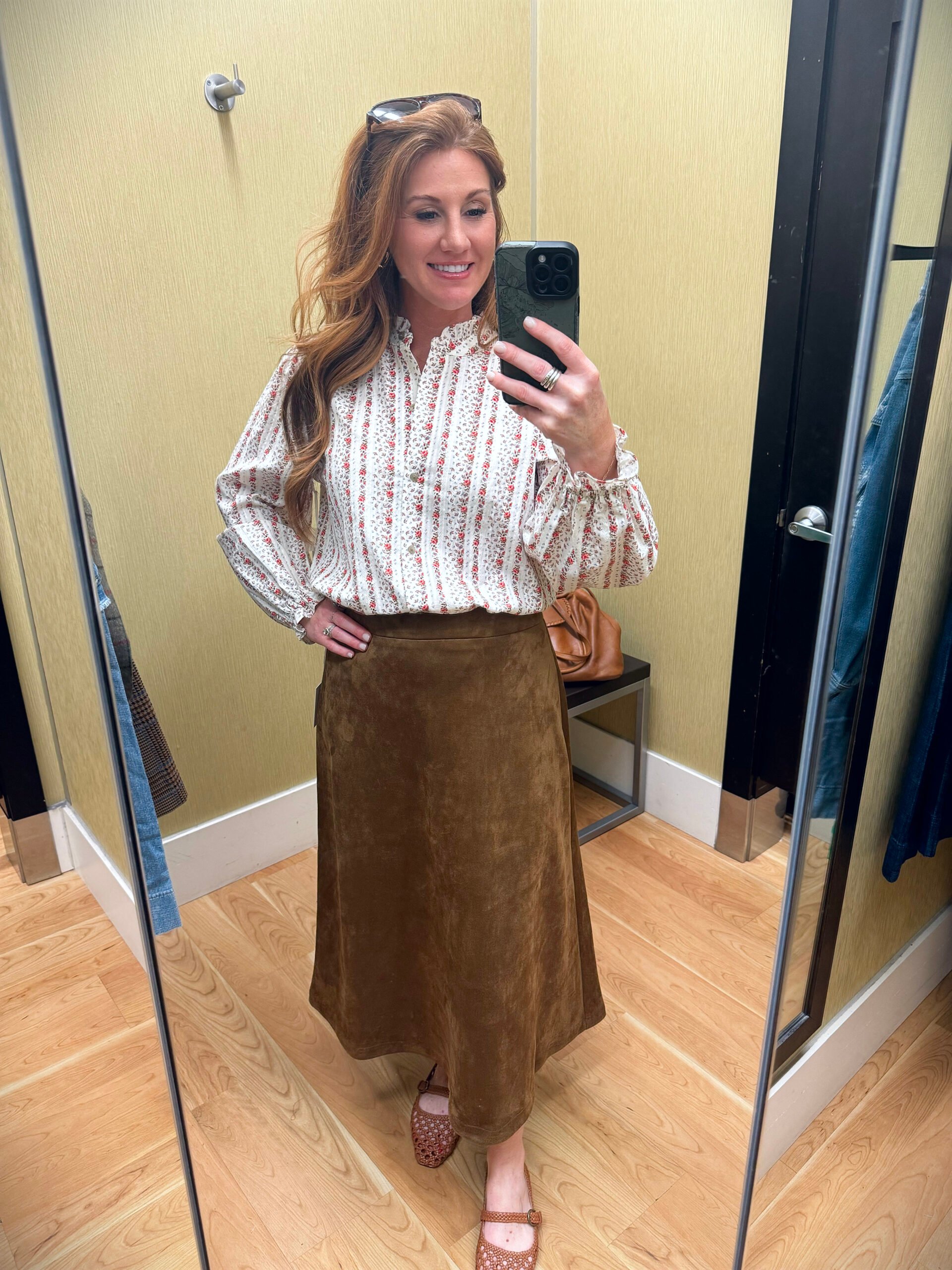 .Stephanie wearing a ruffle collar blouse with a faux suede shirt from Kohl's