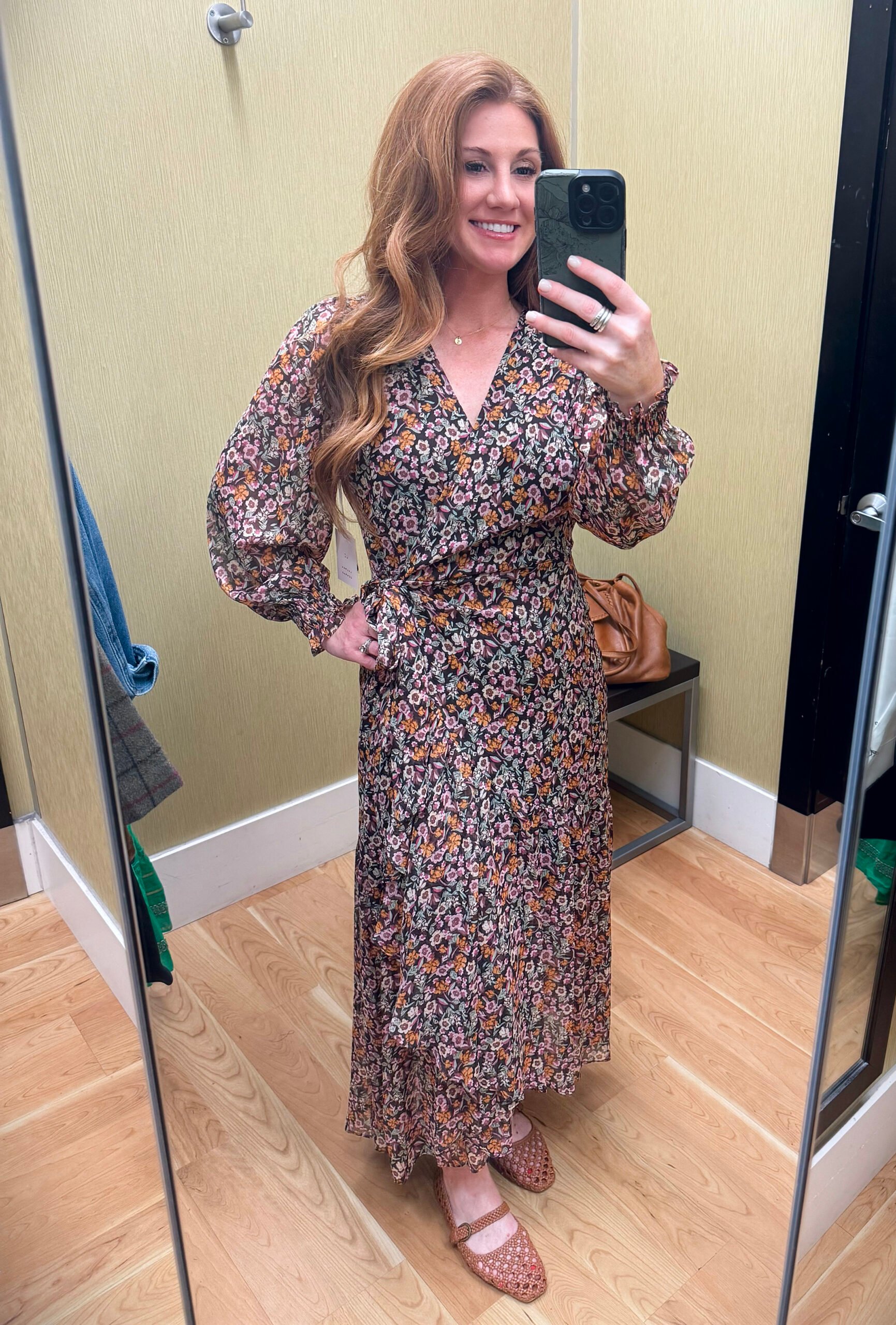 Stephanie modeling a classic wrap dress from Kohl’s at the perfect length for fall weddings