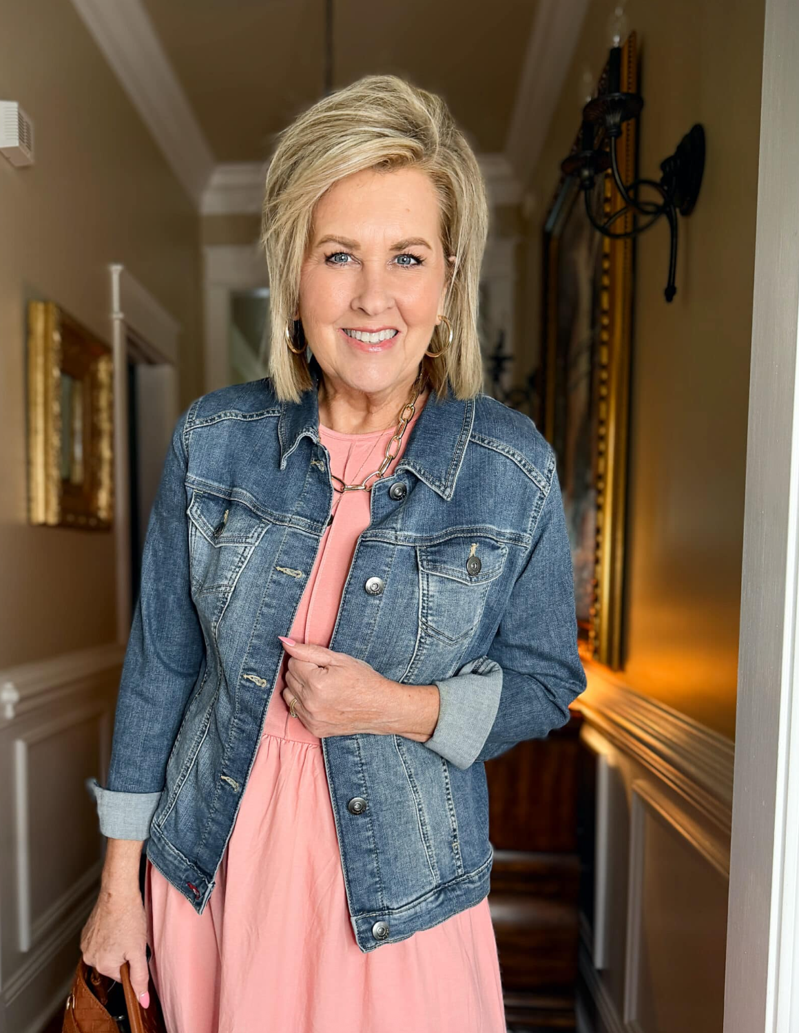 Tania Stephens is wearing a pink dress and a denim jacket from Amazon