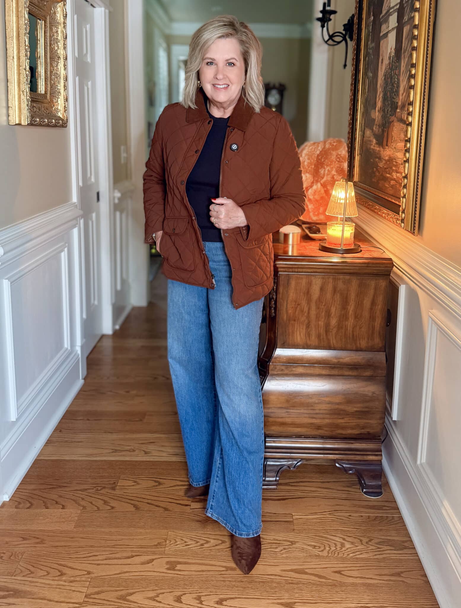 Tania Stephens wearing a  Walmart brown barn coat and wide leg jeans