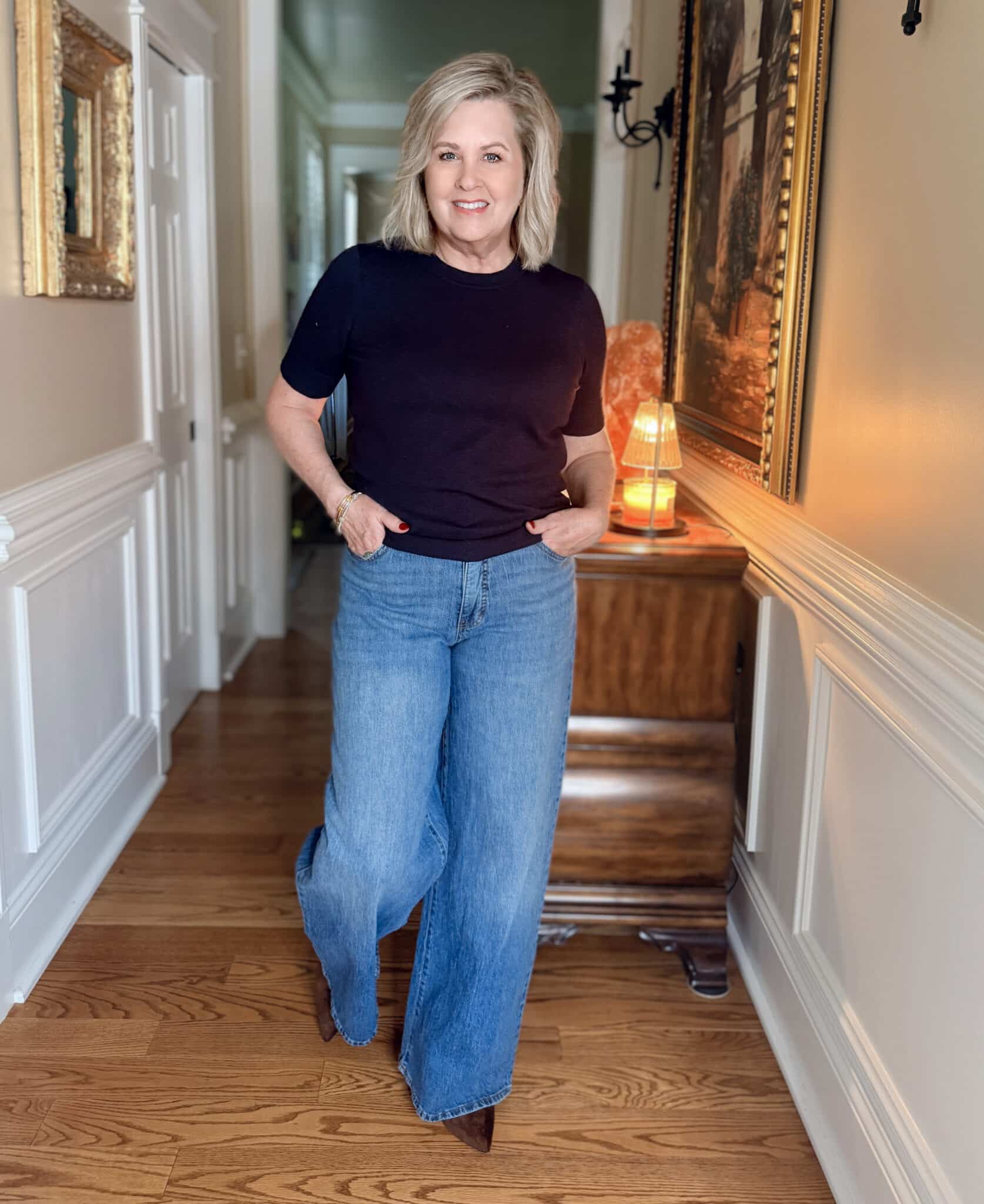 Tania wearing a Walmart navy Free Assembly sweater and wide leg jeans