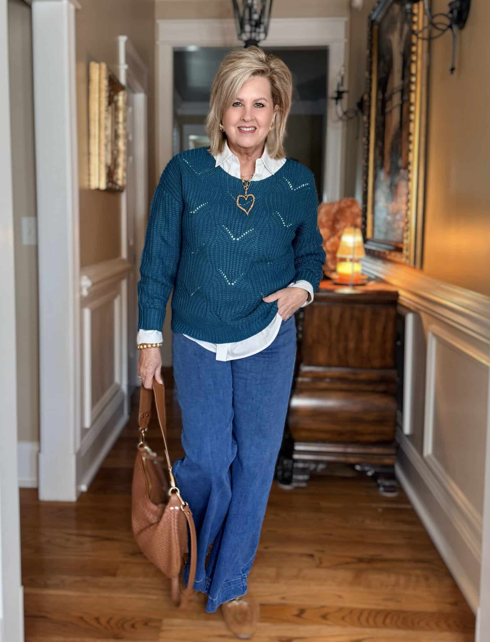 Tania is wearing an Amazon Teal Pointelle Sweater with a White Button Down Shirt