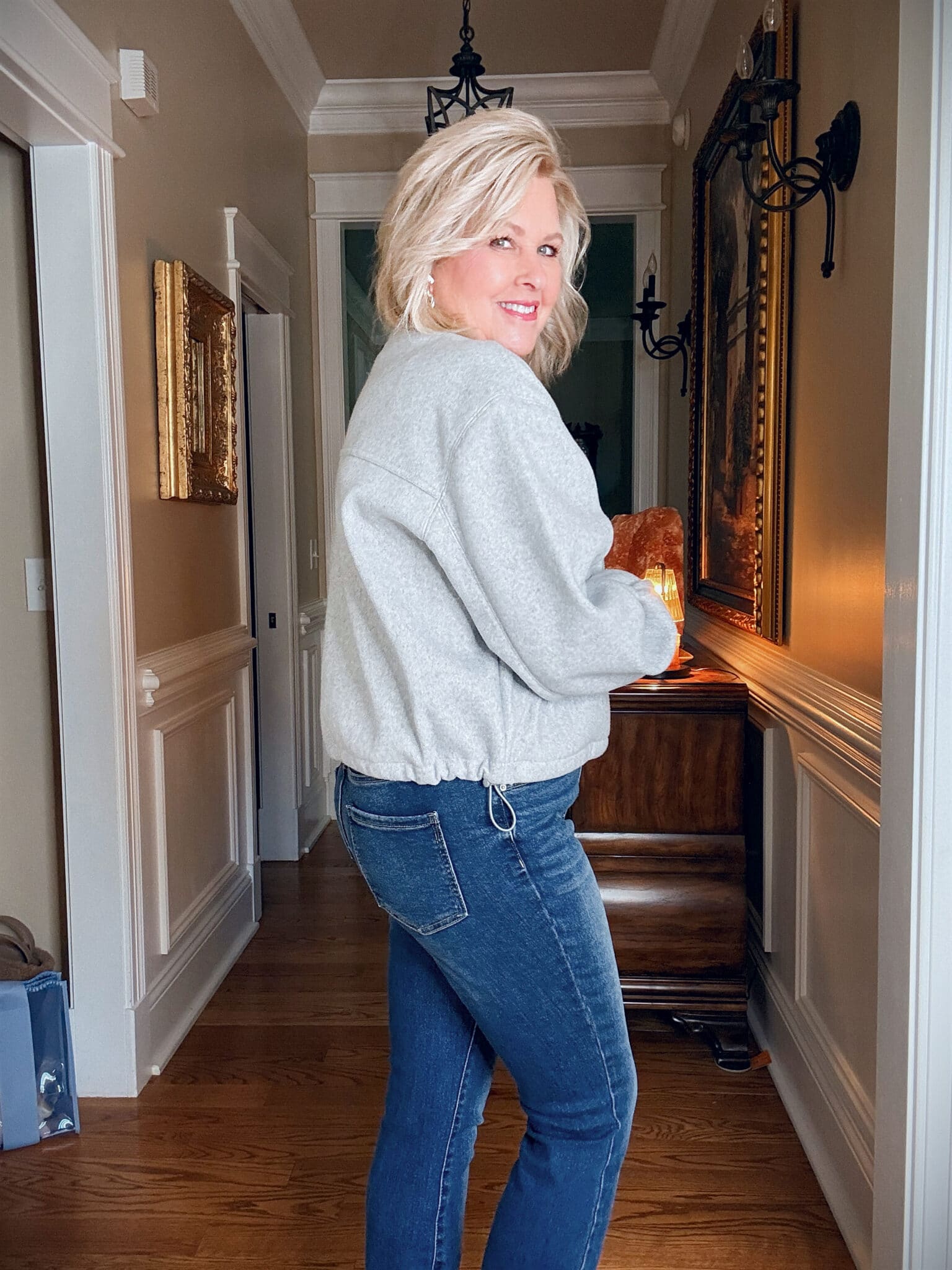 Tania wearing a light gray bomber jacket from Amazon