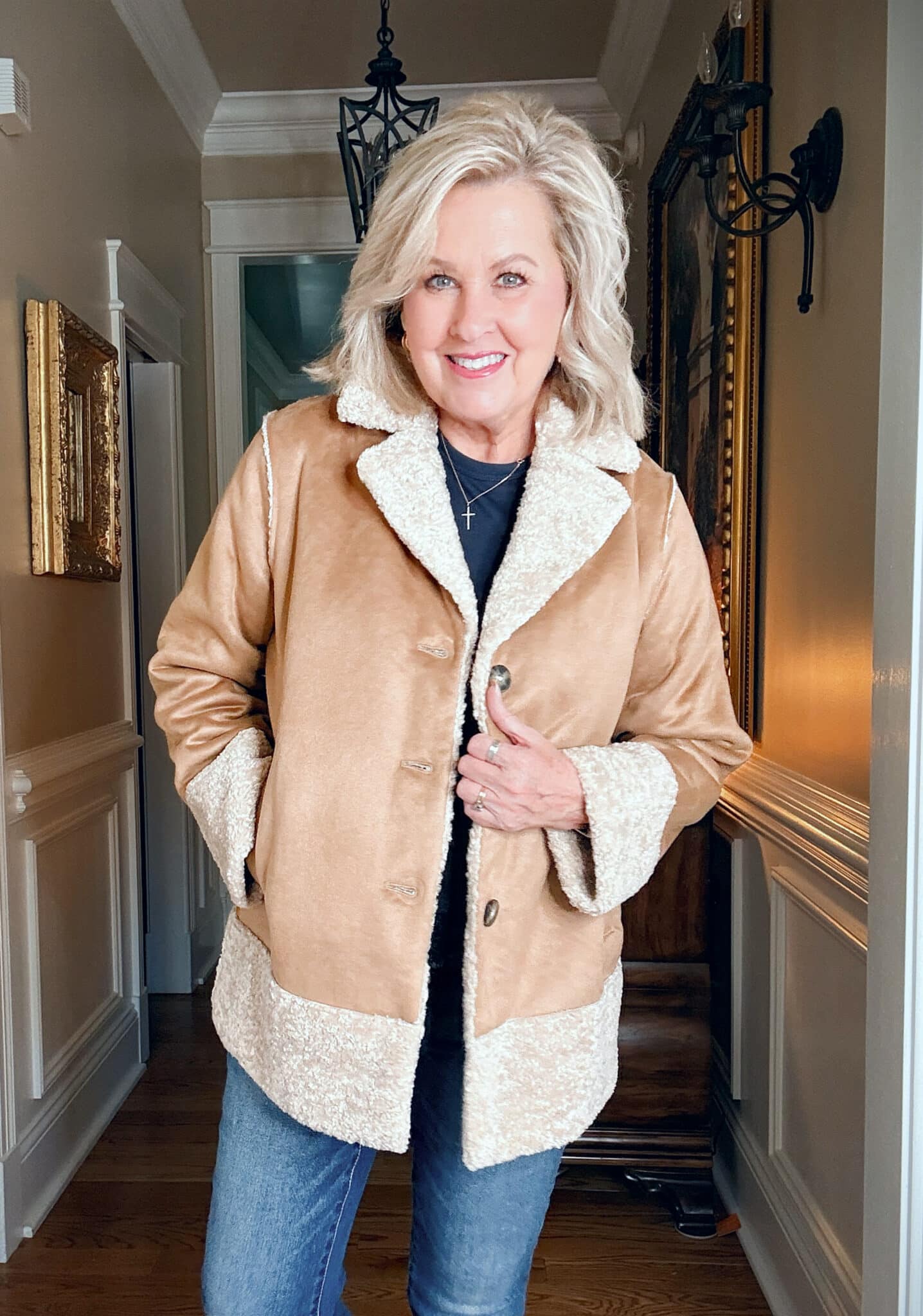 Tania wearing a navy tee with a camel  faux suede/shearling jacket from J.Jill