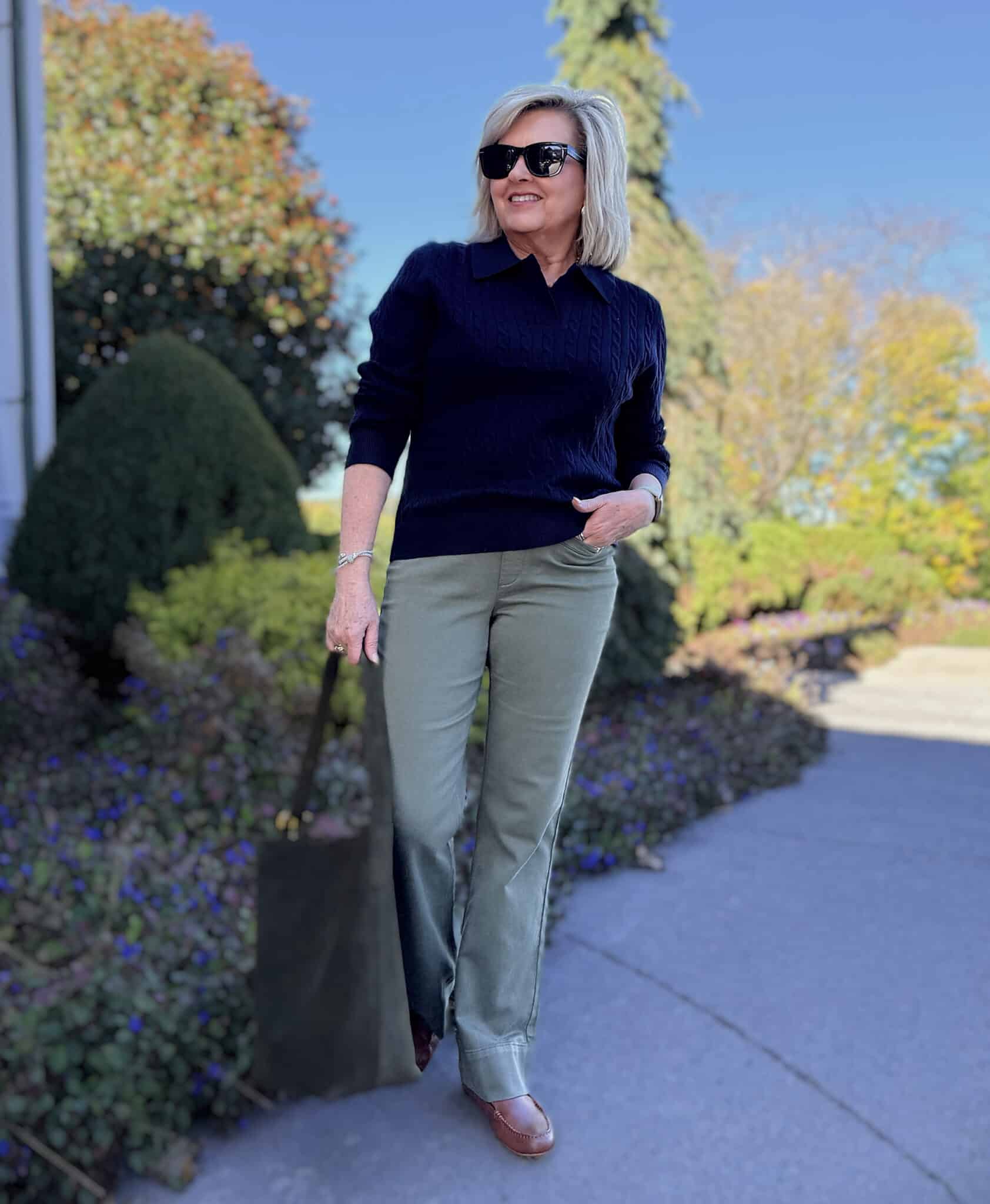 Tania wearing a navy sweater with olive jeans from Amazon
