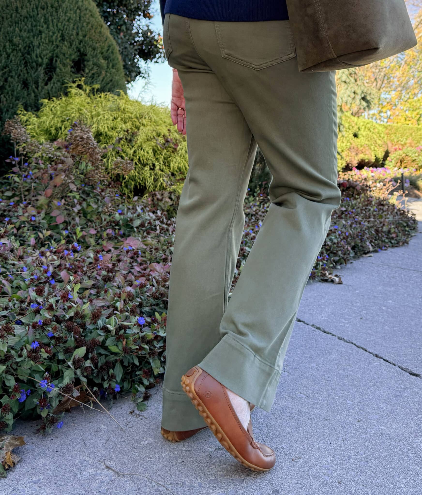 Tania wearing olive jeans from Amazon and caramel driving shoes