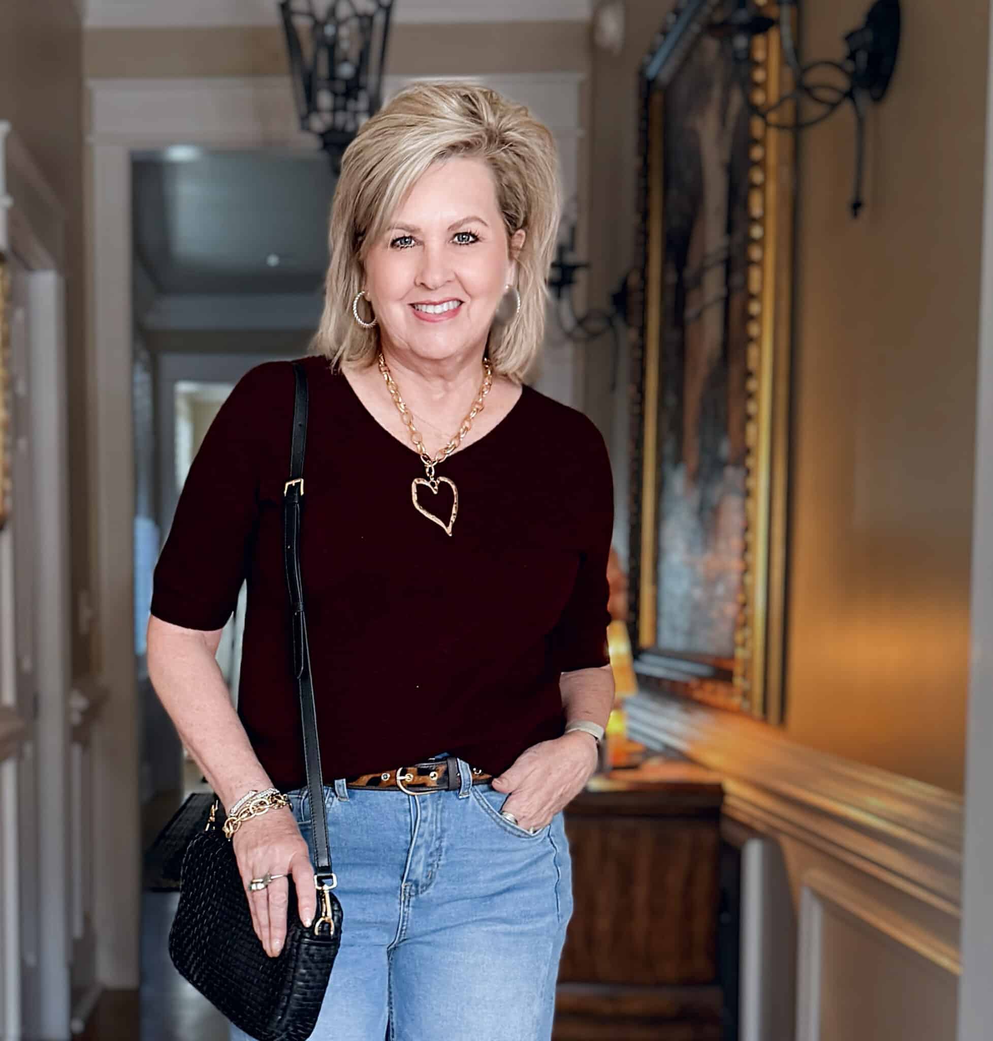 Tania wearing a burgundy sweater from Amazon