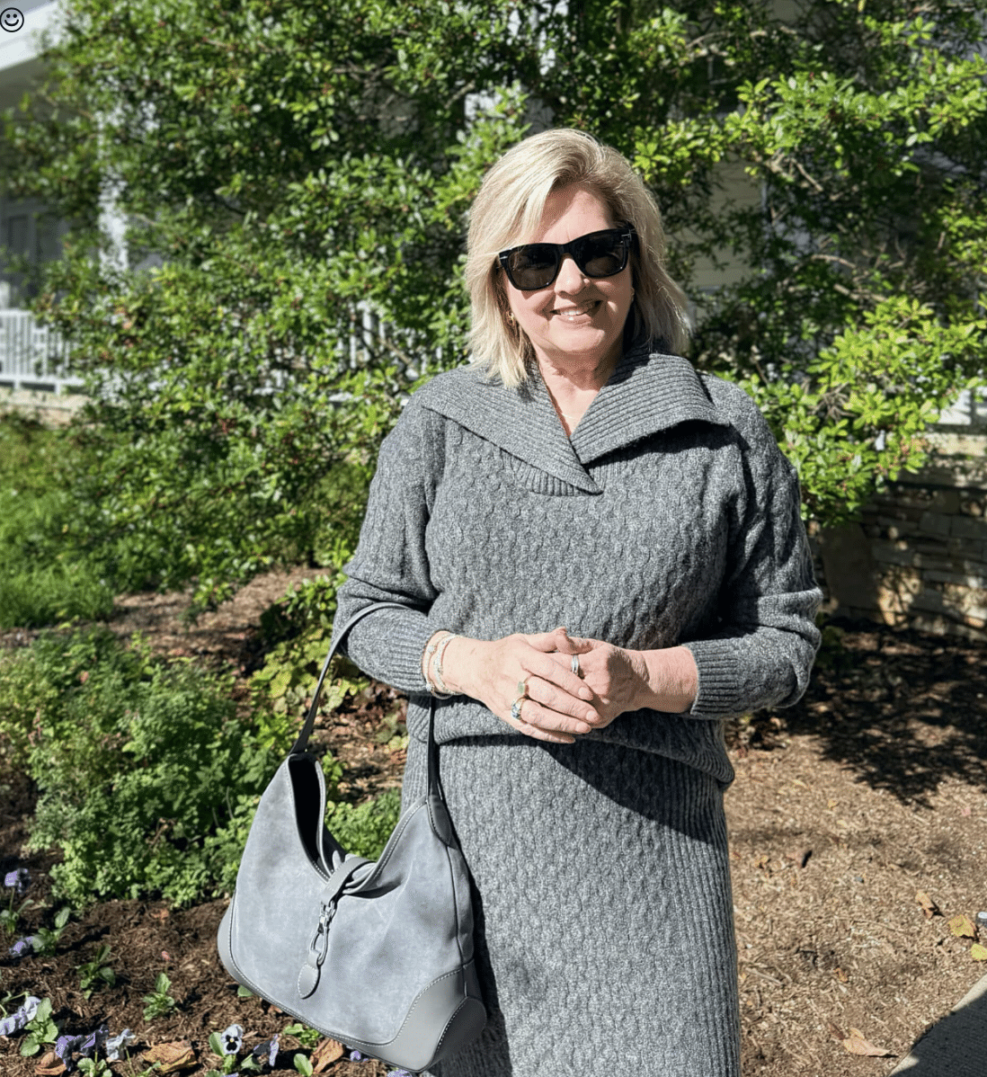 Tania styling a Talbots gray collared sweater and gray ankle boots, gray handbag, and sunglasses