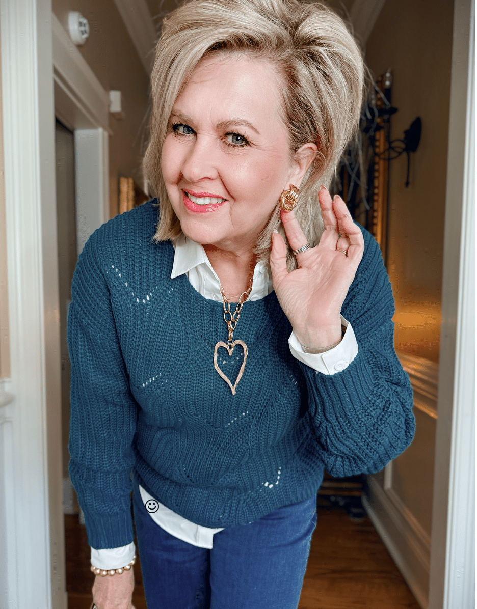 Tania is wearing an Amazon Teal Pointelle Sweater with a White Button Down Shirt with gold jewelry