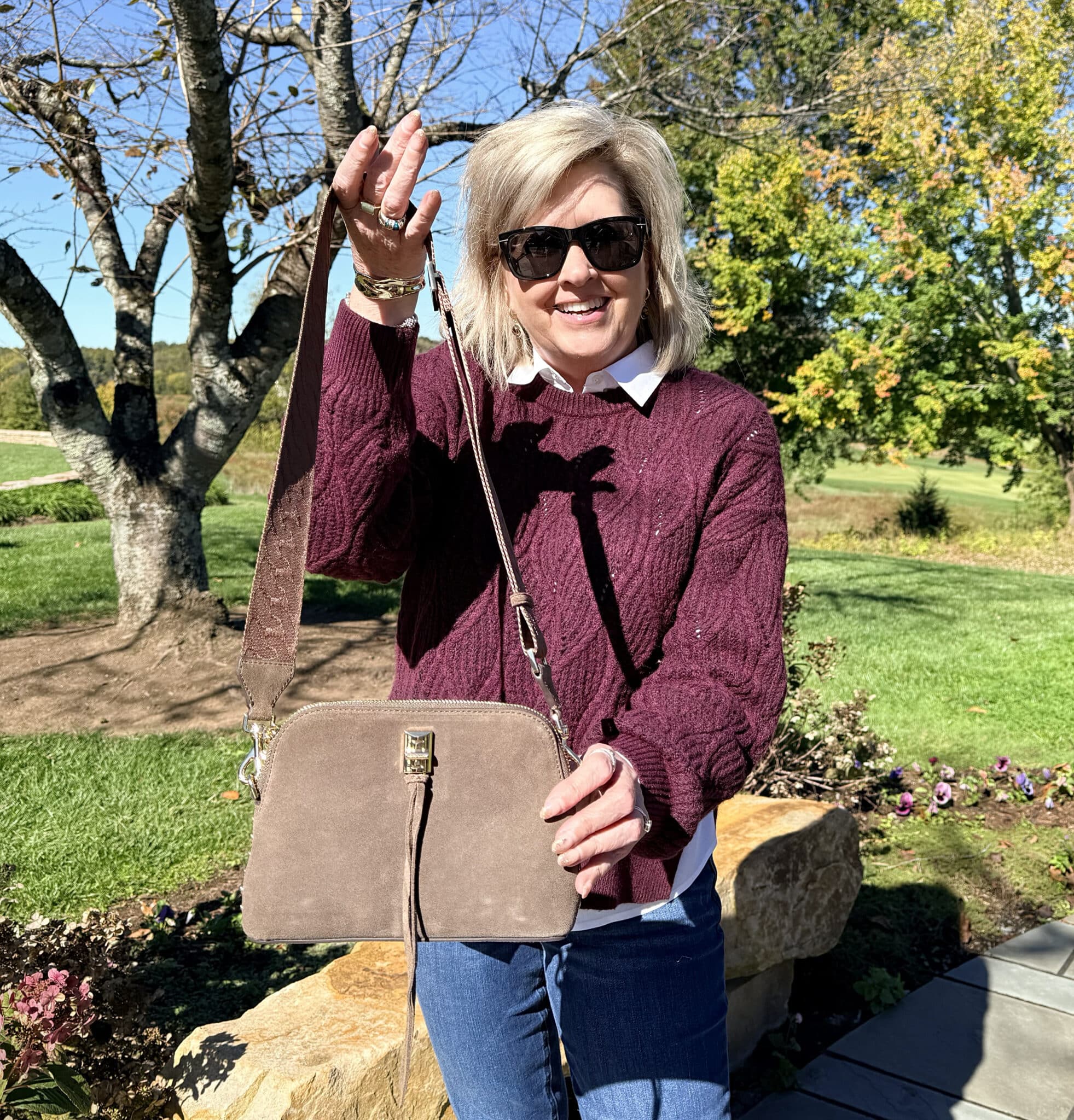 Tania holding a brown crossbody from Nordstrom Rack