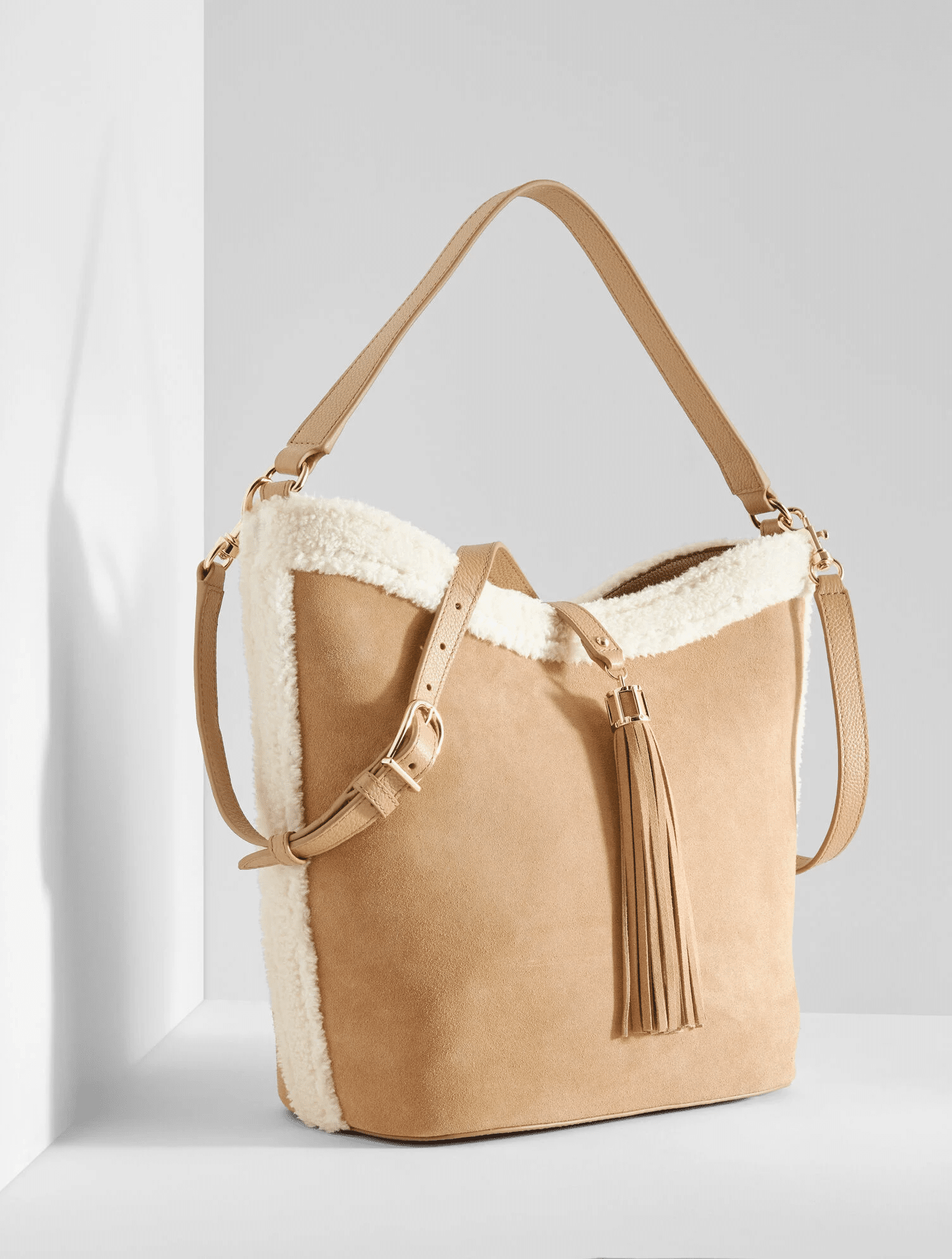 The Best Winter Handbags for 2025 50 is not old tania stephens fashion blogger faux shearling bucket bag