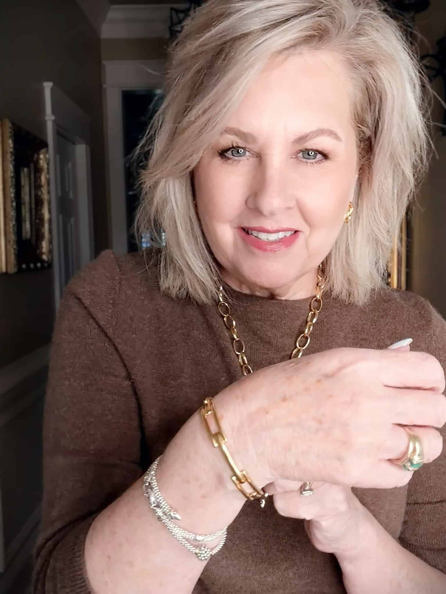 Monica Vinader Signature Link Bangle on wrist against sweater fabric