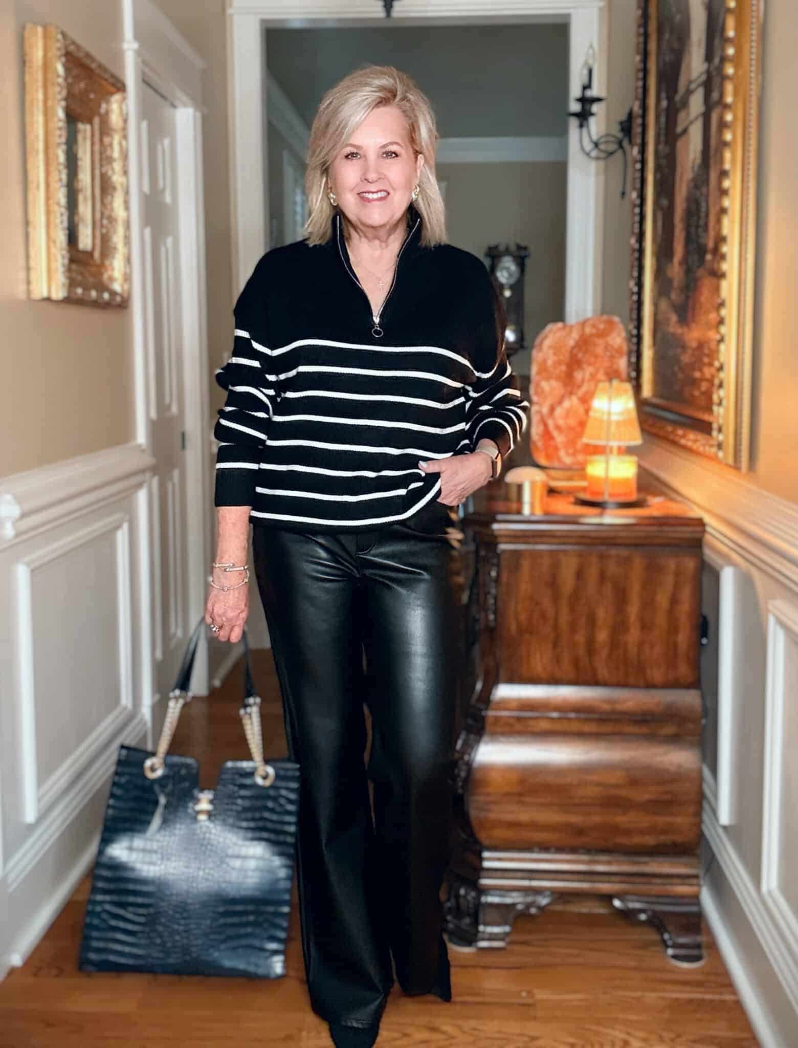How to wear black after 50 with faux leather flare pants and a soft knit sweater