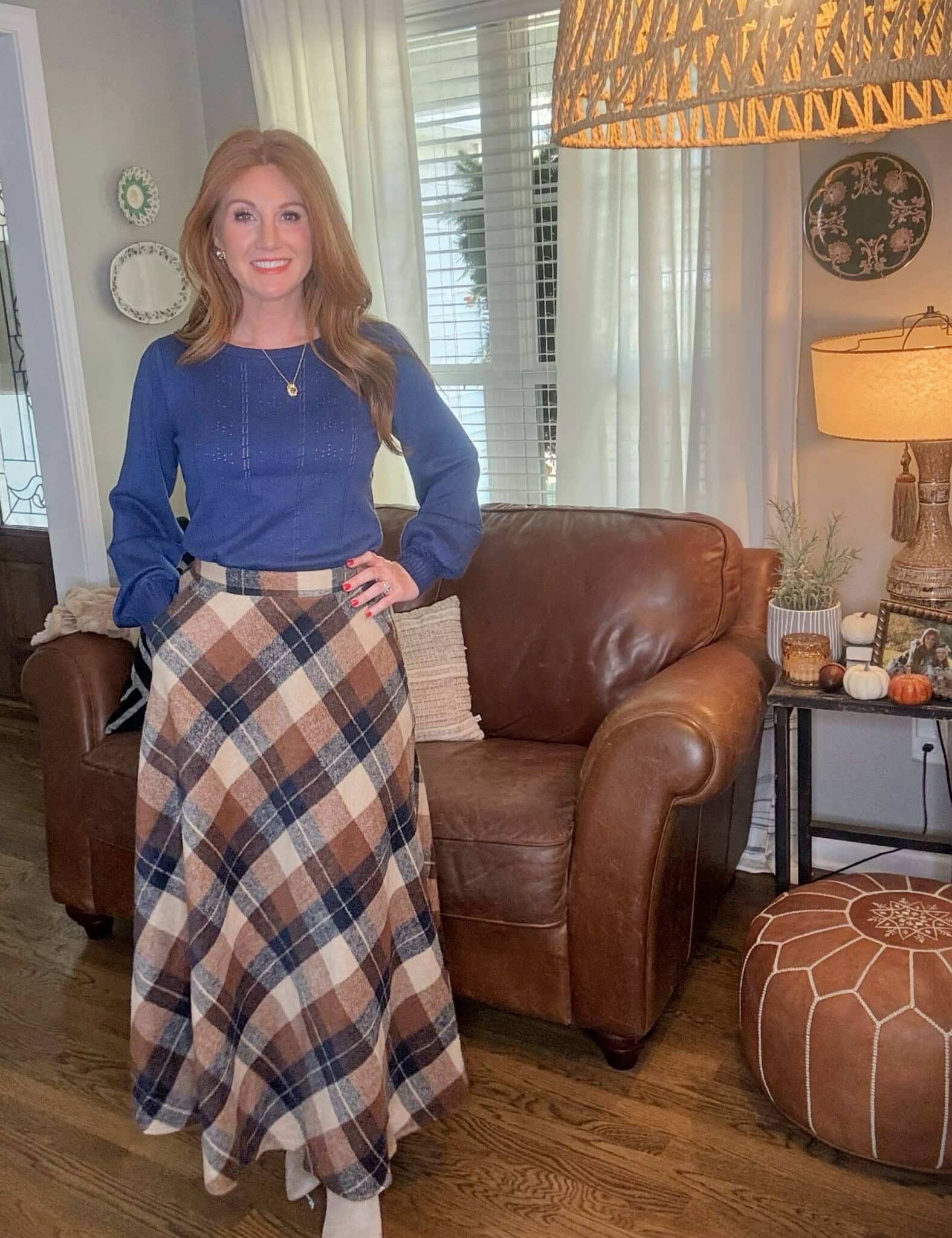 Stephanie wearing a plaid wool maxi skirt and puff sleeve sweater, styled for petite professional outfits