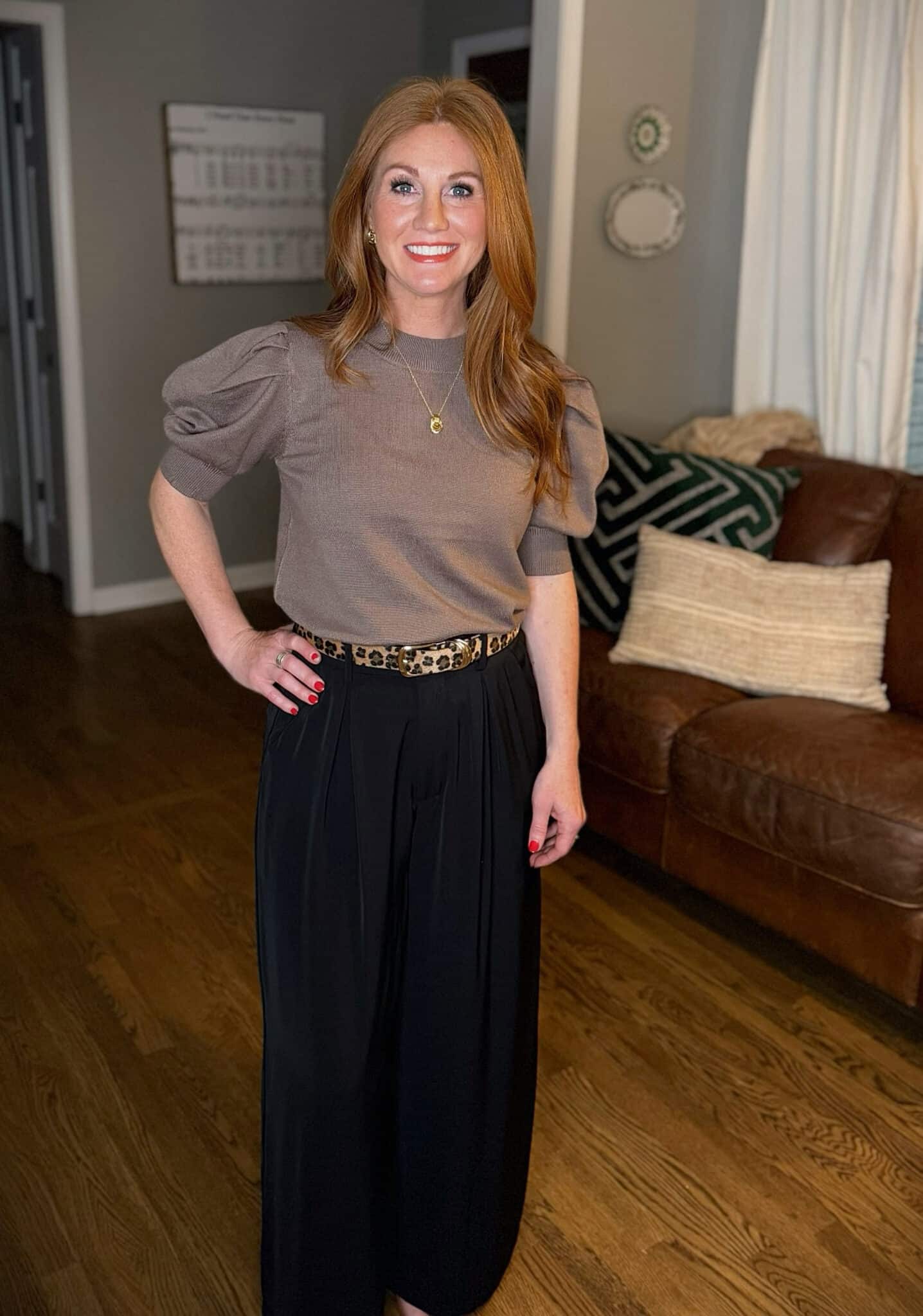 Wide-leg palazzo pants in short length styled on petite woman with fitted puff sleeve sweater