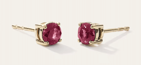 14K gold ruby solitaire stud earrings worn with holiday outfit