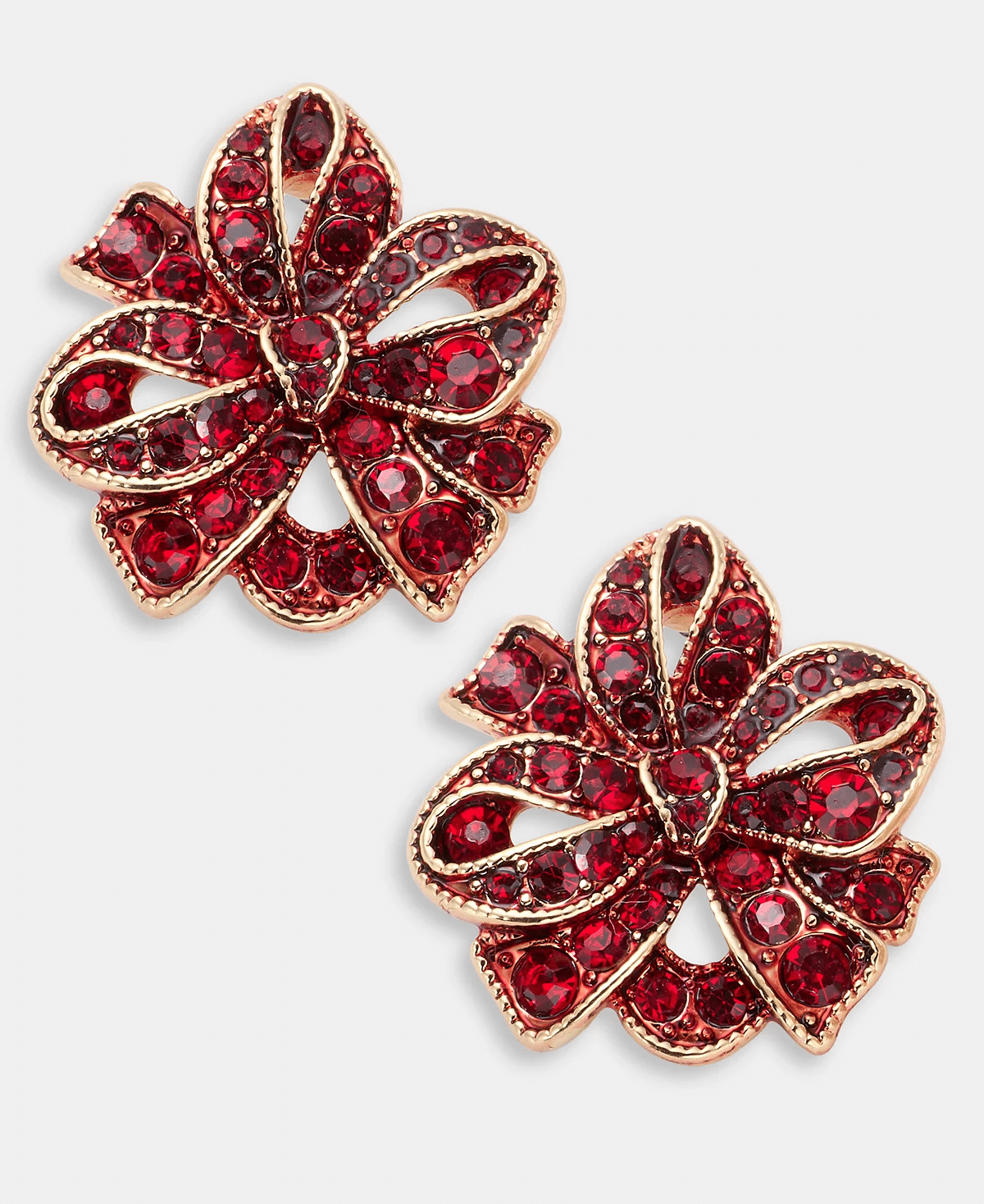 red and gold bow earrings styled with a black turtleneck