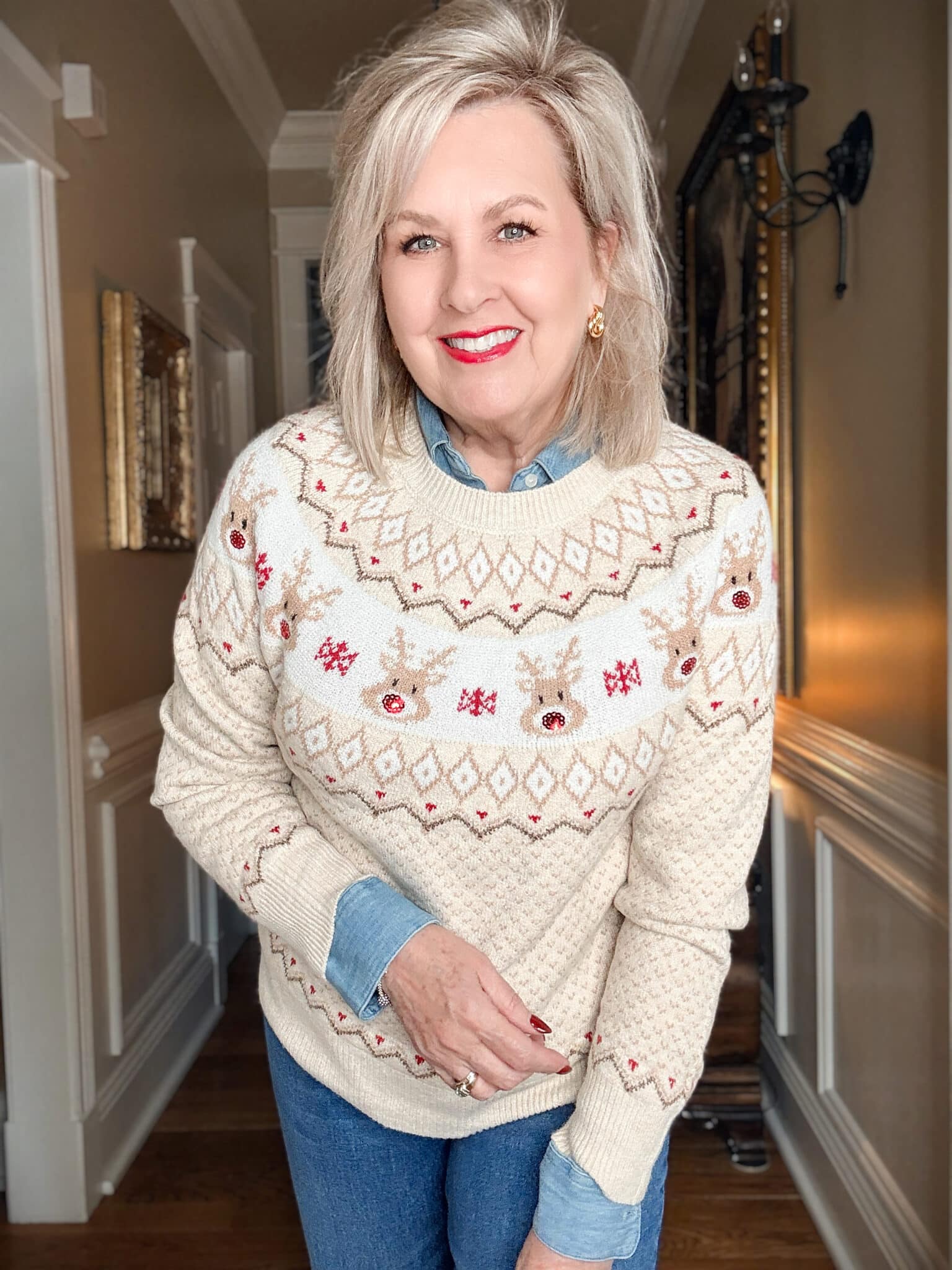 Tania wearing a sequined reindeer holiday sweater from Walmart