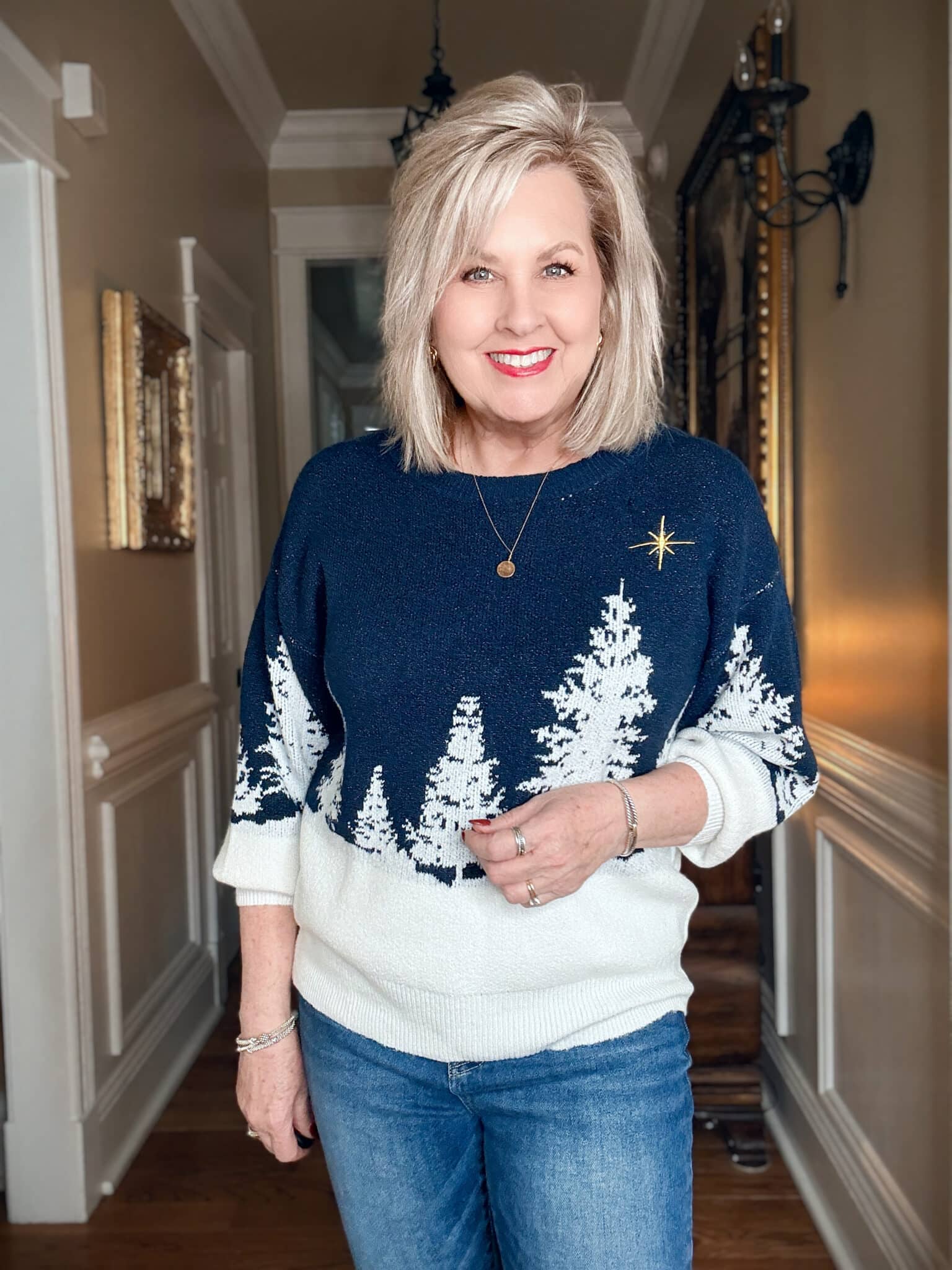 Tania wearing a navy & white holiday sweater from Walmart