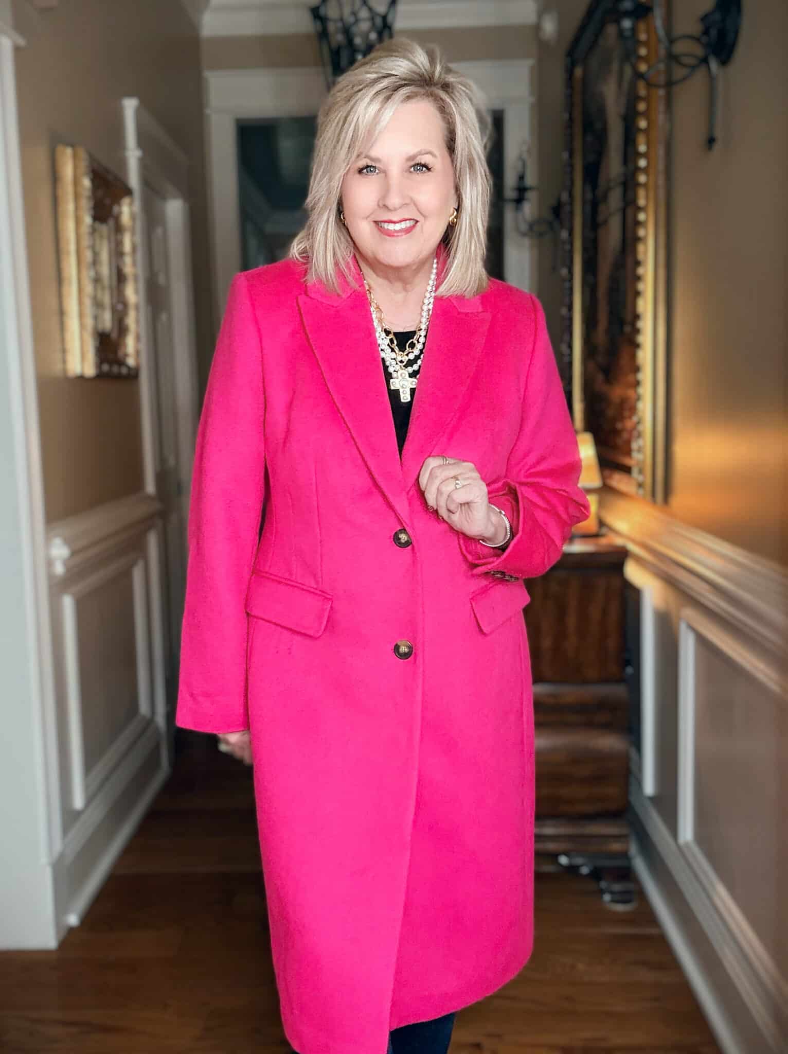 Tania wearing a bright pink dress coat from Ann Taylor