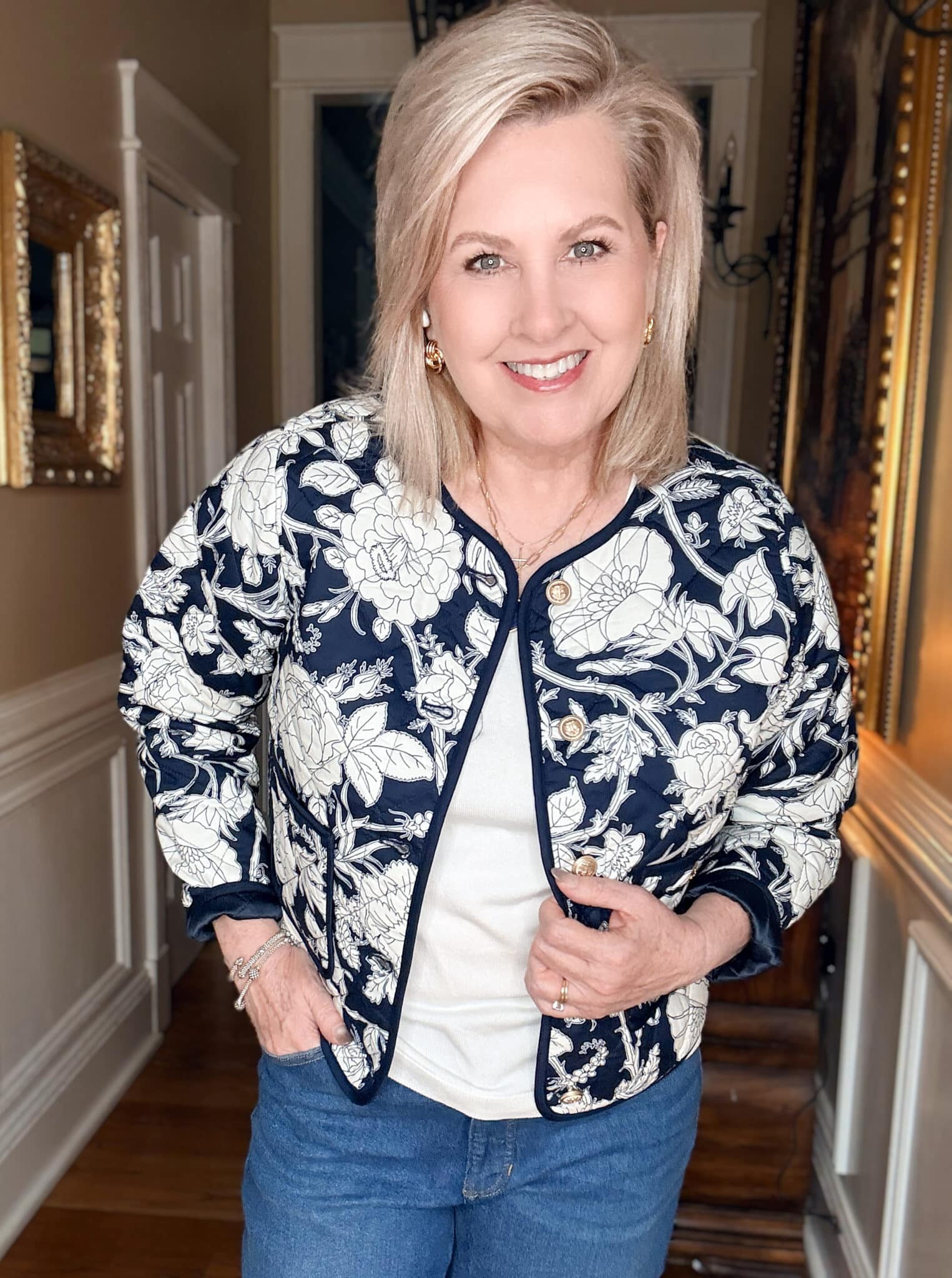 Tania wearing a blue & white quilted floral jacket and a white top from Walmart