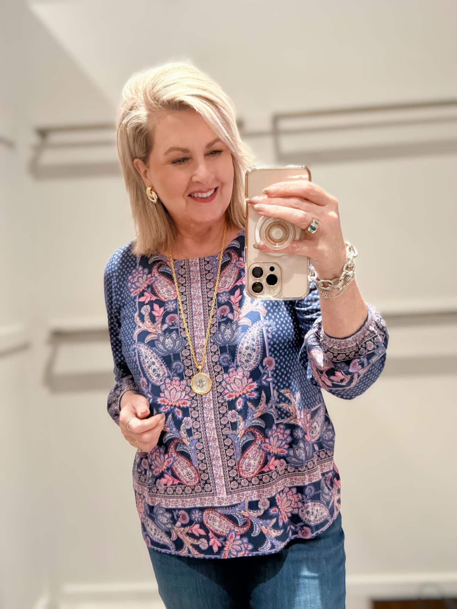 Tania wearing a brightly colored printed top from J.Jill