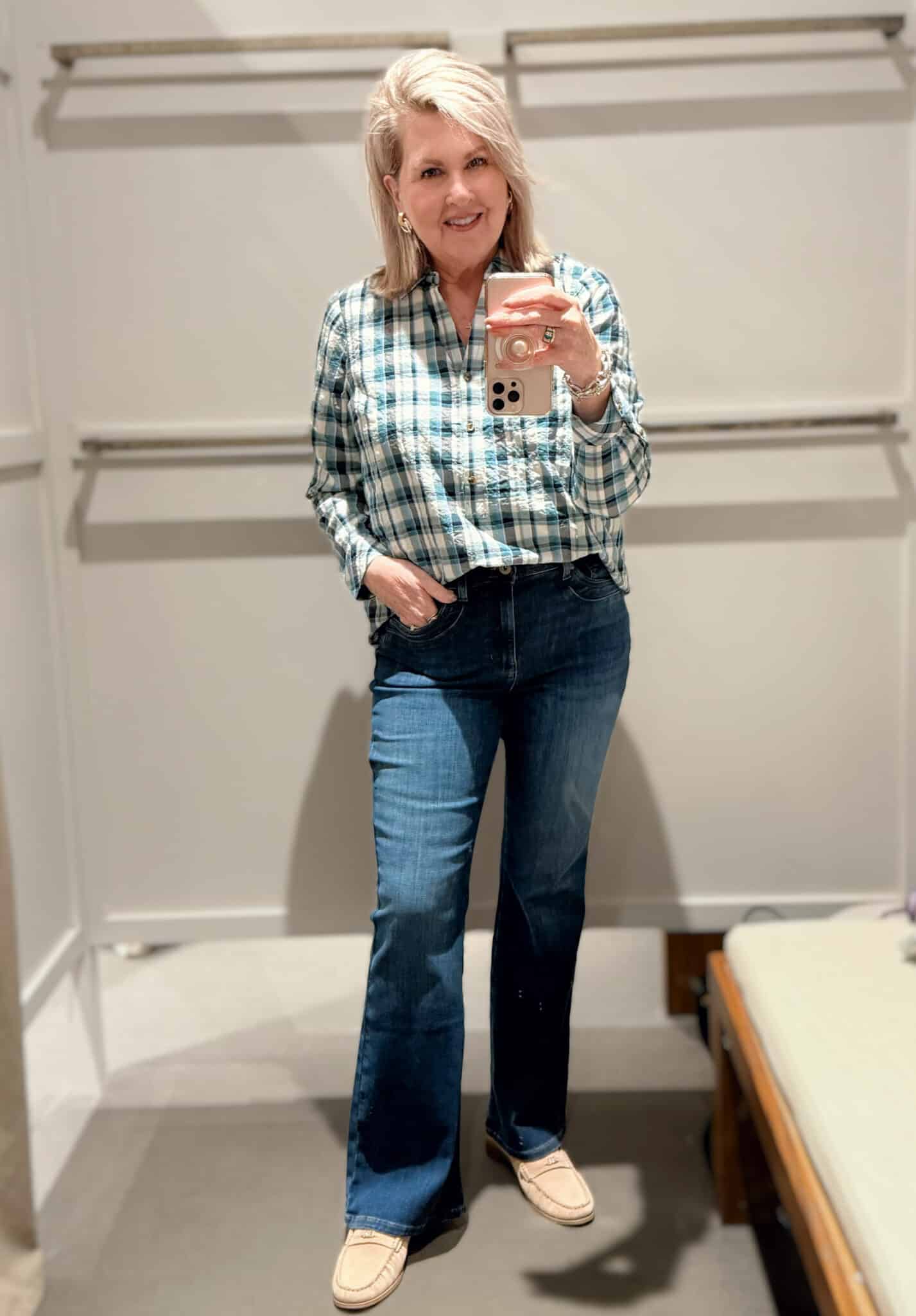 Tania wearing a checked top and flare jeans from J.Jill